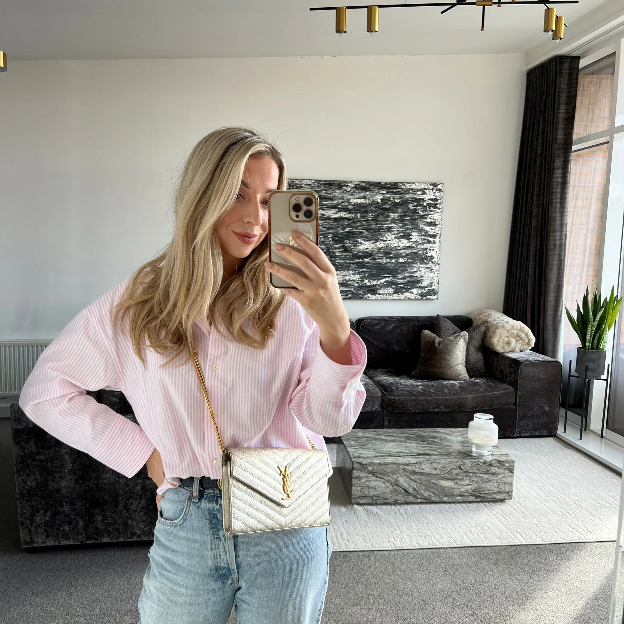 Saint Laurent YSL Large Envelope Wallet on Chain Bag in Gold shown on model