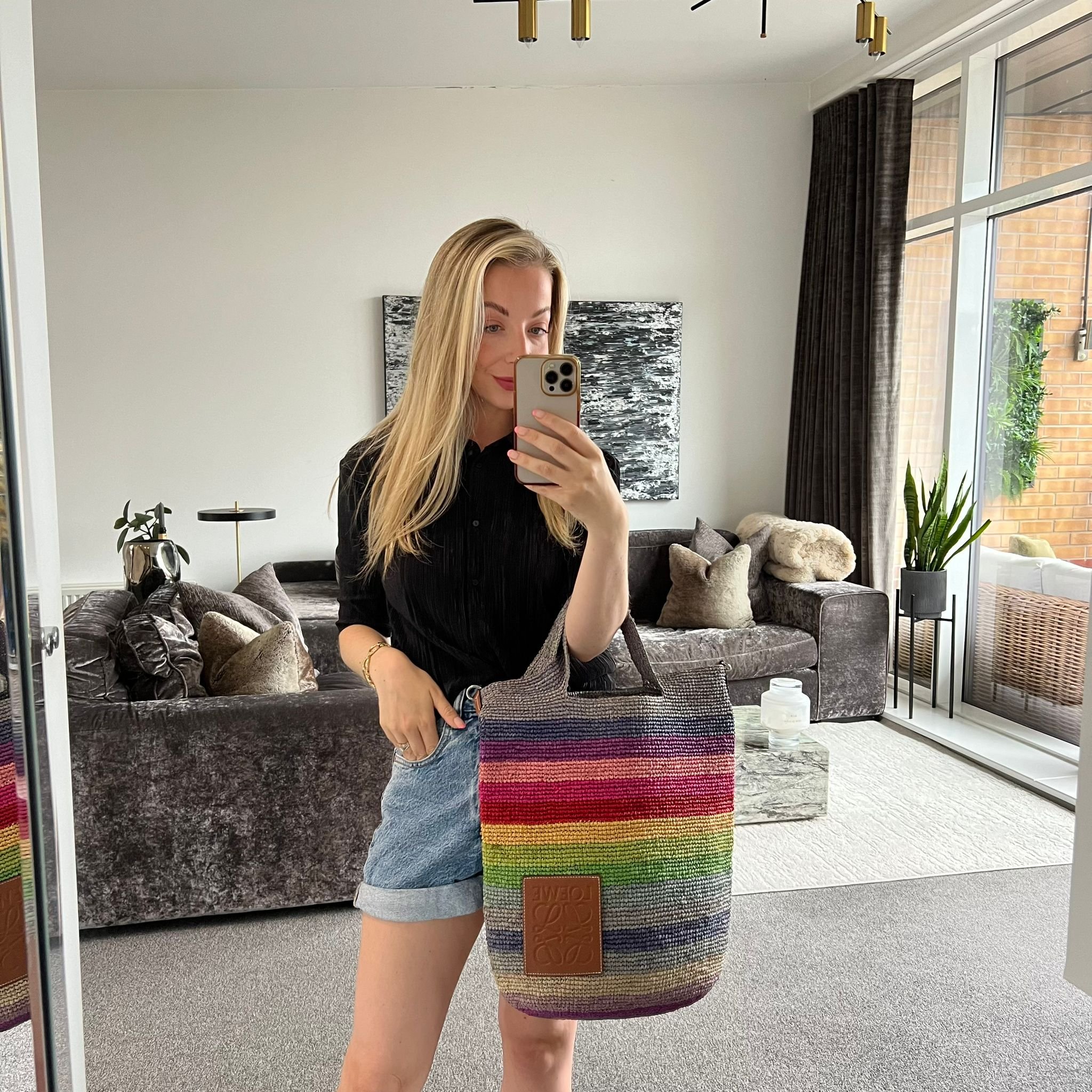 Loewe x Paula's Ibiza Slit Large Bucket Bag in Rainbow Raffia shown on model
