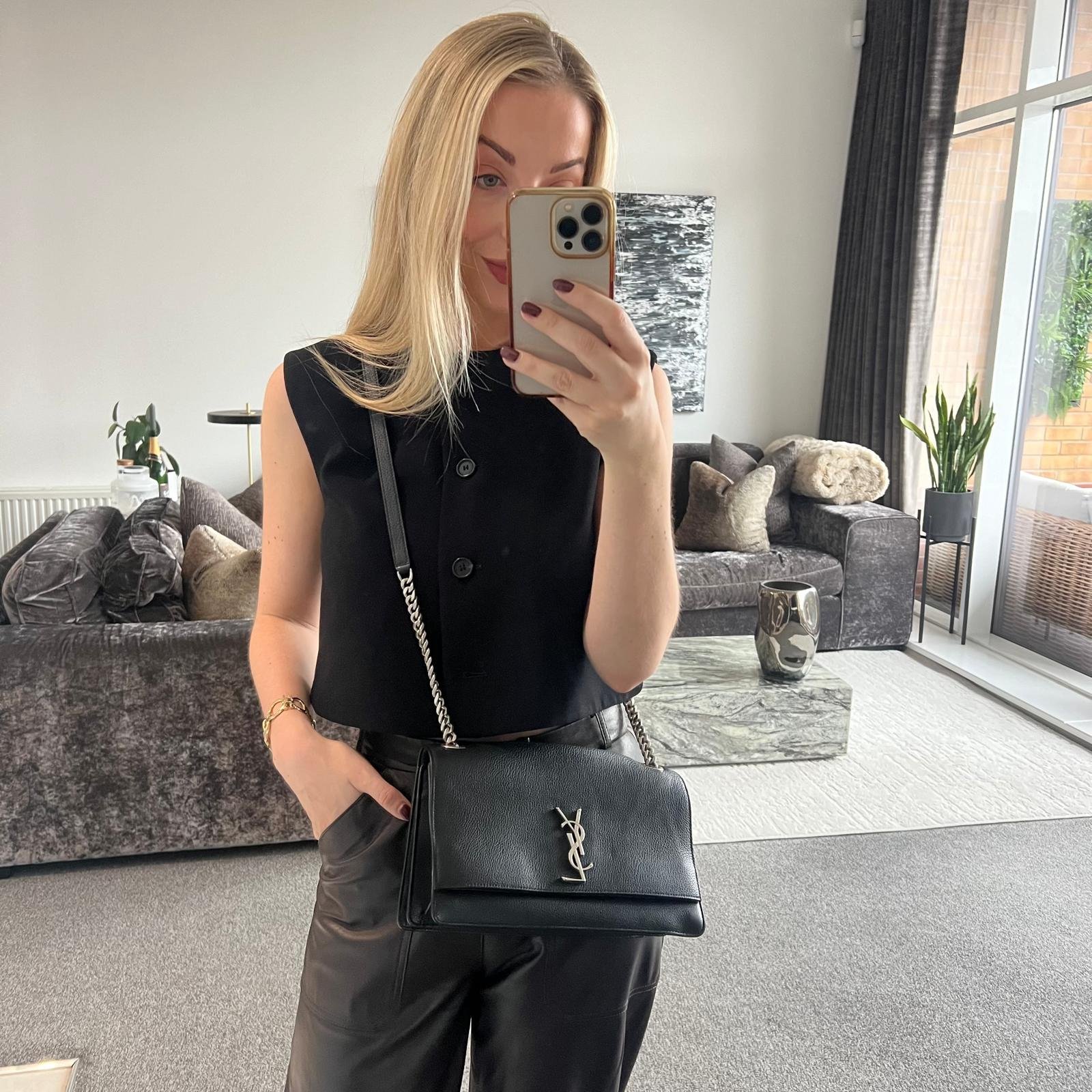 Saint Laurent YSL Sunset New WH Bag in Black Grained Leather shown on model