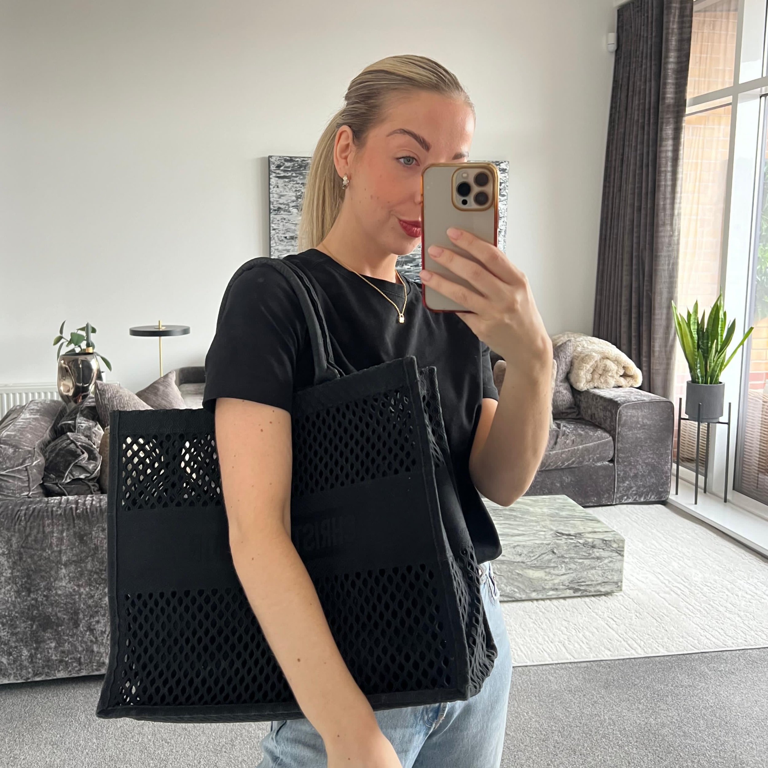 Christian Dior Book Tote Bag in Black Embroidered Mesh Canvas shown on model