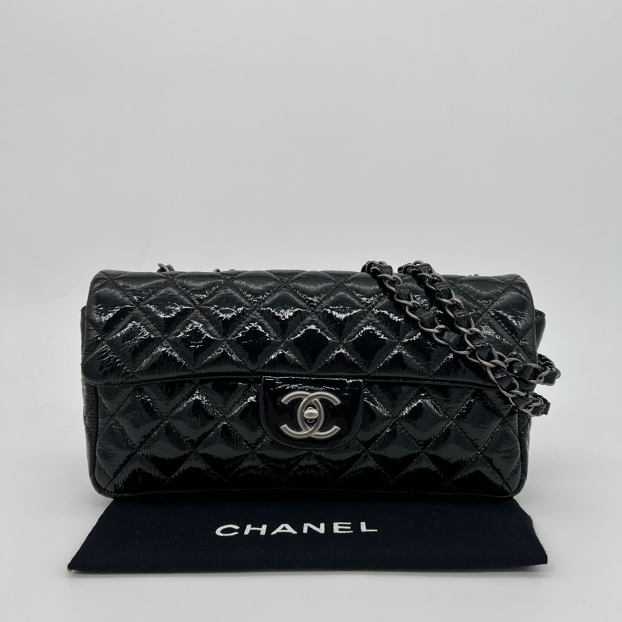 Chanel Quilted East West Flap Bag in Black Distressed Patent leather with packaging