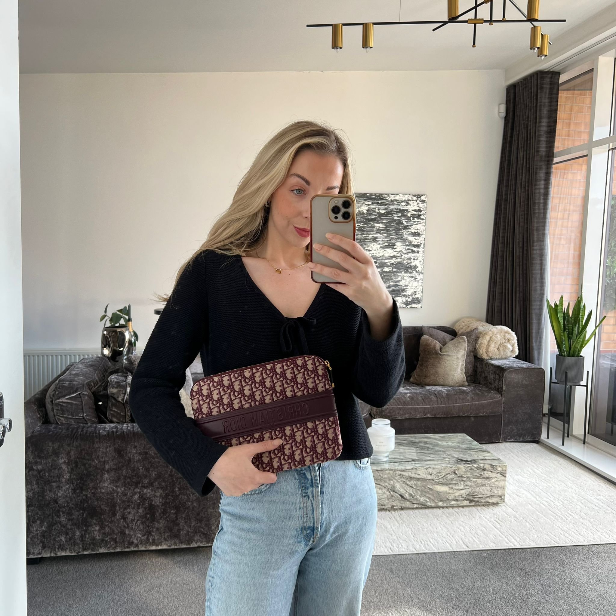 Christian Dior Oblique Clutch Pouch in Burgundy Bordeaux Canvas shown on model