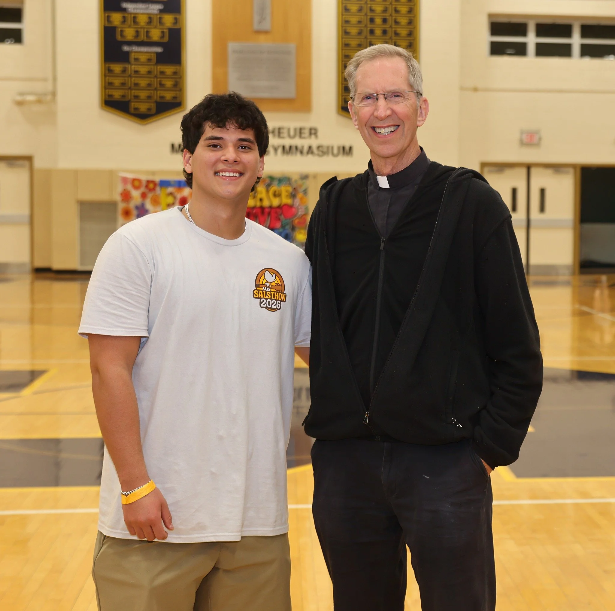 Fr. Mike McCue, OSFS, with Salesianum student at SALSTHON