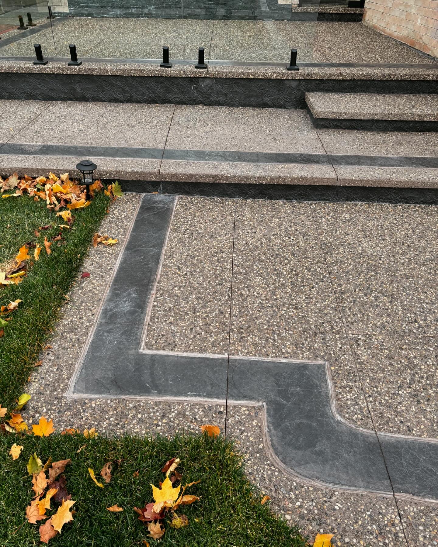 New driveway and a Grand front entrance veranda! Exposed aggregate with a Mauve colour hue and charcoal border