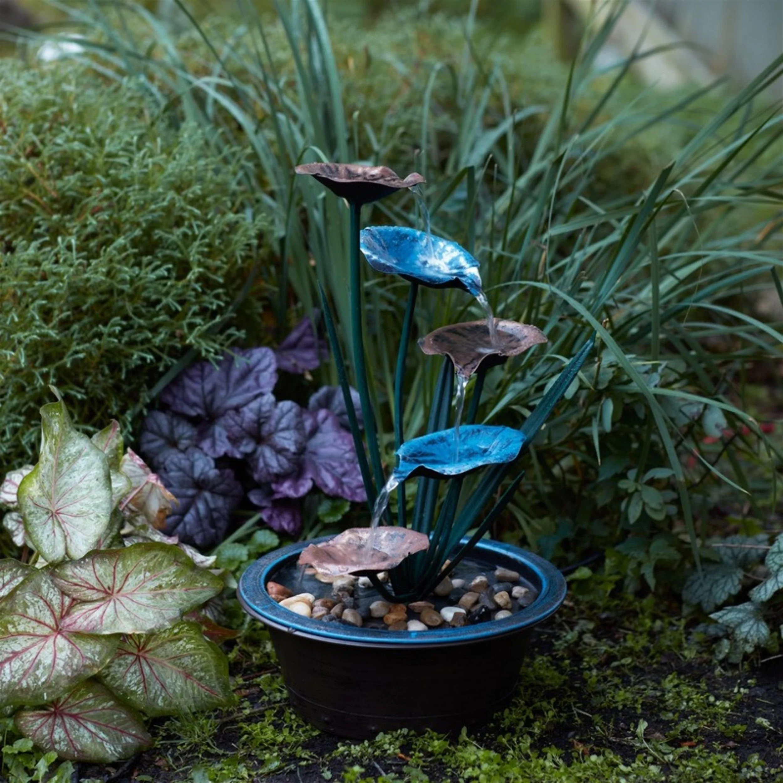 bronze-lotus-leaf-fountain-boho-luxury-patio.jpg