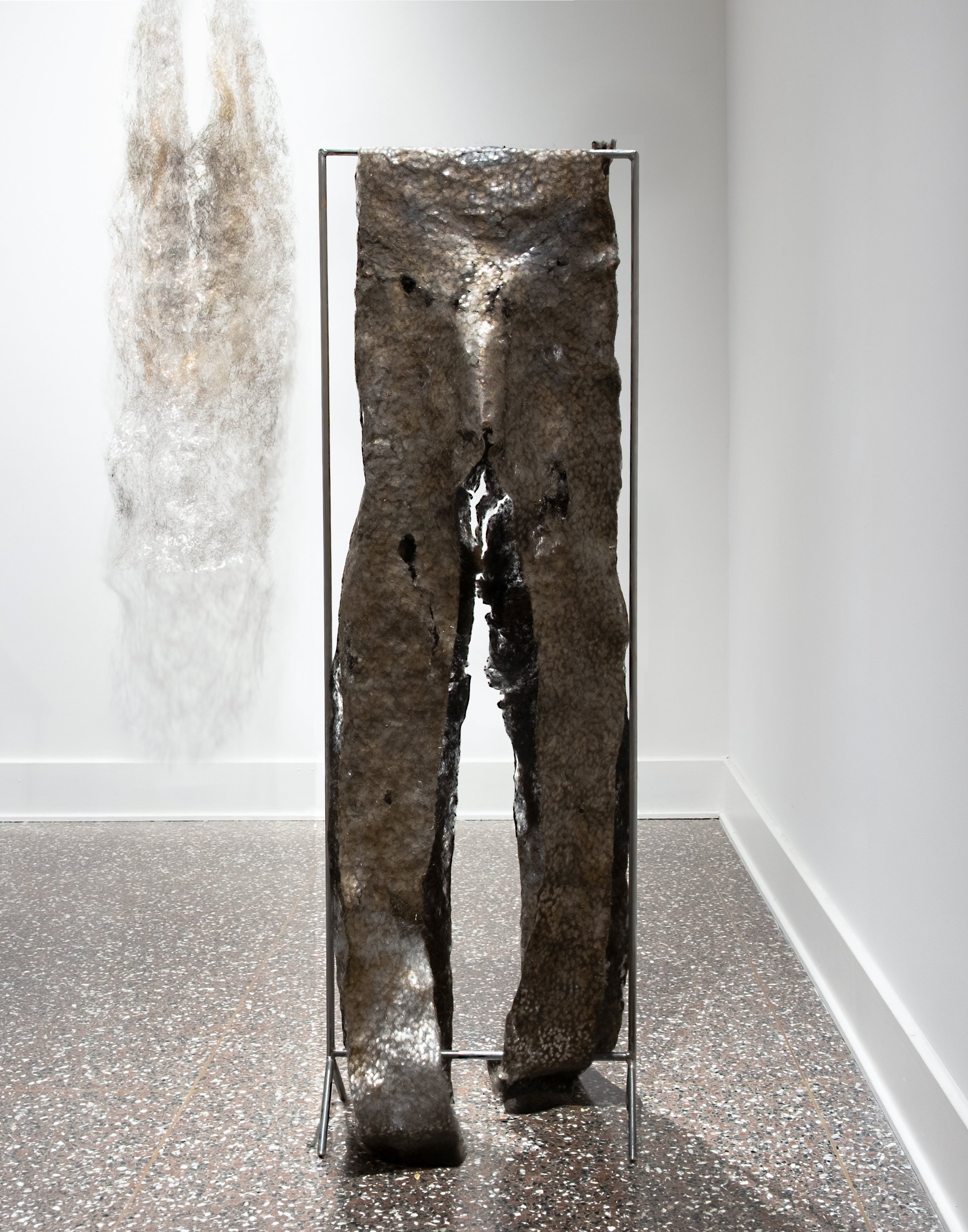 Held Up / Worn Out, 2025, hammered steel wool, fabricated steel mount