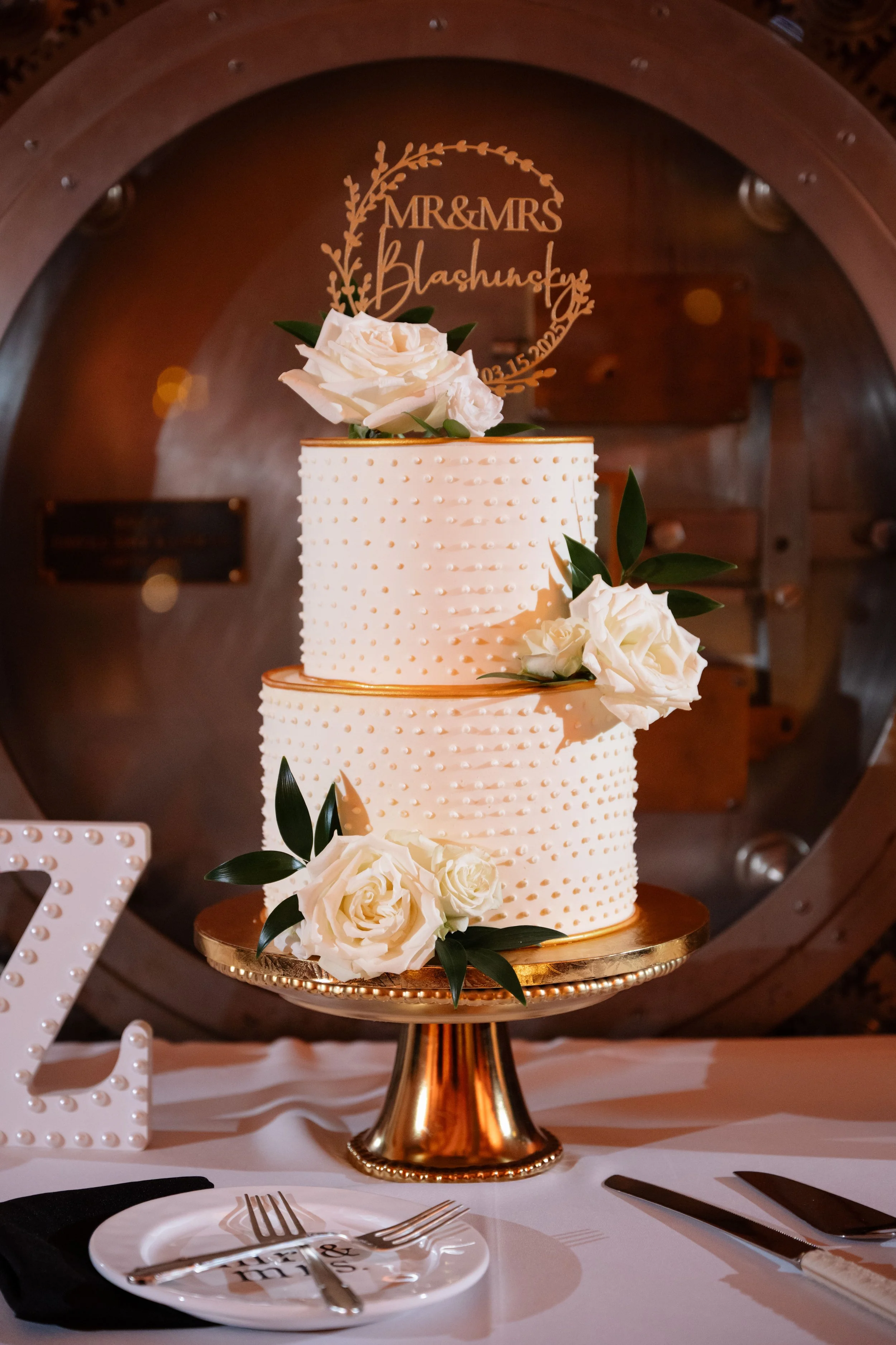 smooth white buttercream with buttercream bead piping and gold fondant (round borders). Fresh flowers 1 (1).jpg