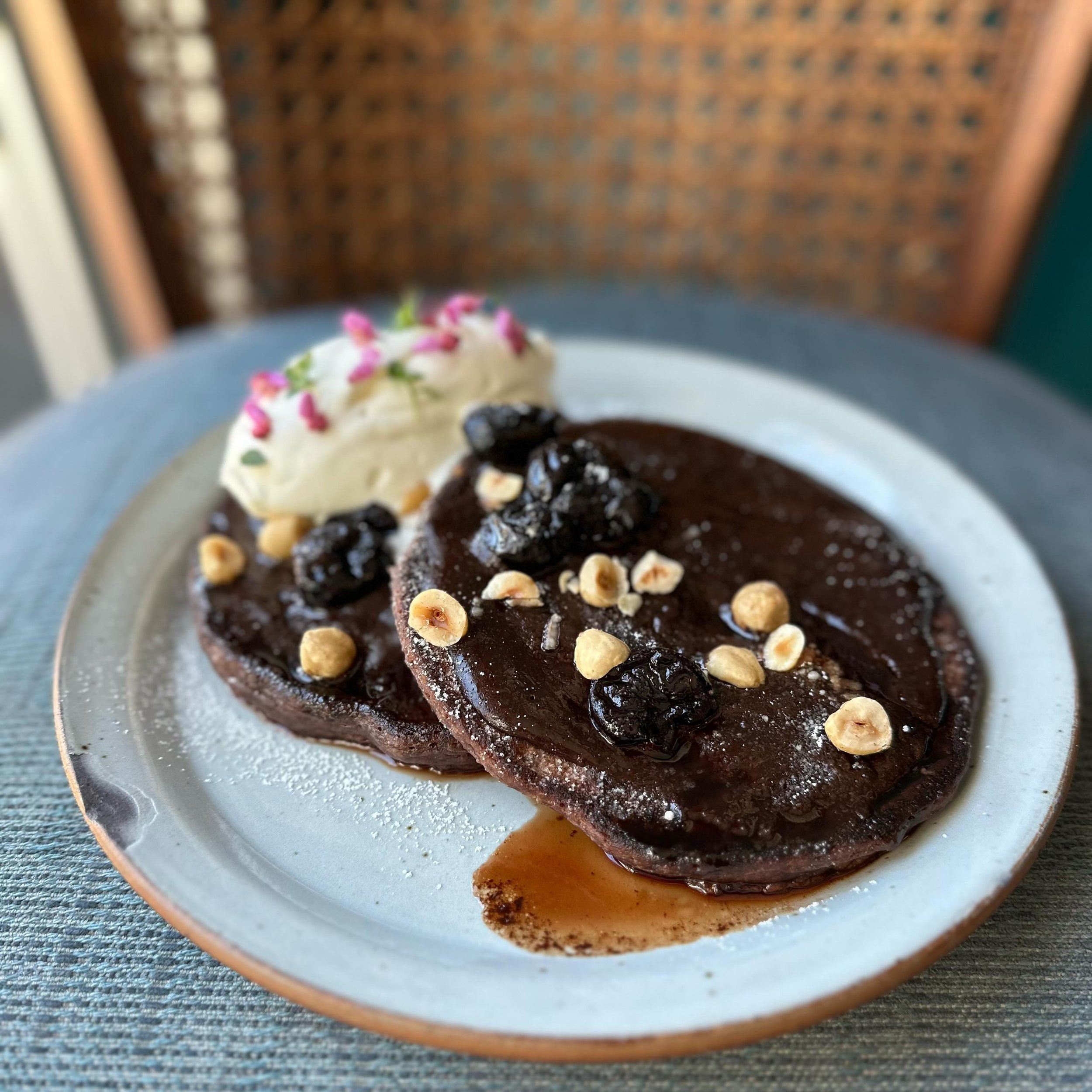 Chocolate-sourdough pancakes
Ganache + cherry molasses syrup
Chantilly cream + local flowers

On the brunch menu Sat + Sun from 10-2 
Cause you deserve fancy pancakes.
Book a table through @resy link in BIO 👆
❤️&zwj;🔥

#bakerstable #bakerstablebrun