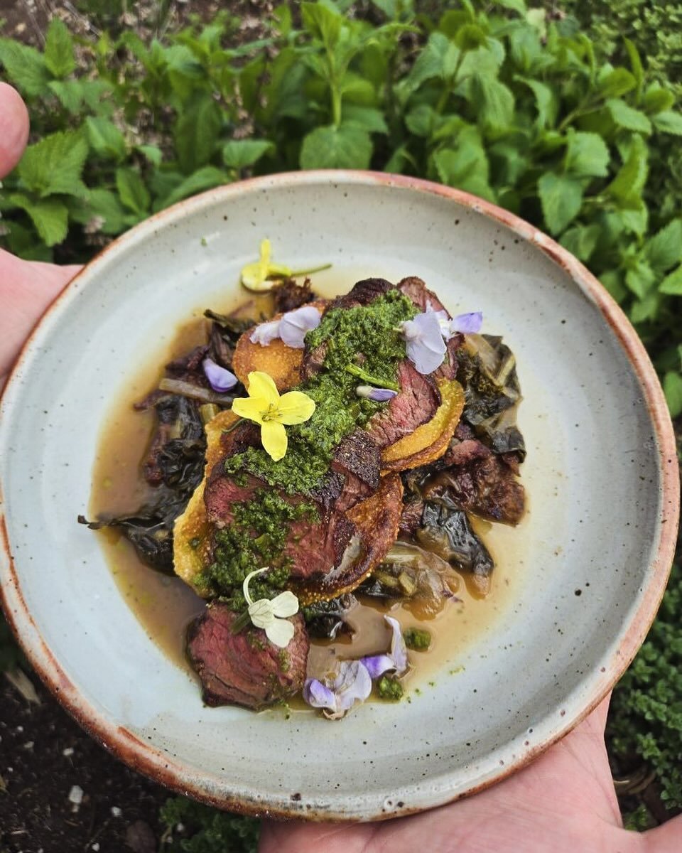 Another shot of one of our fav dishes on this week using the backdrop of our kitchen garden beds.
Freedom Run Farms lamb with Johnny Cakes, braised spring greens and ramp chimichurri.
Here for dinner 5-9 Wed &amp; Th and 5-10 Fr &amp; Sat