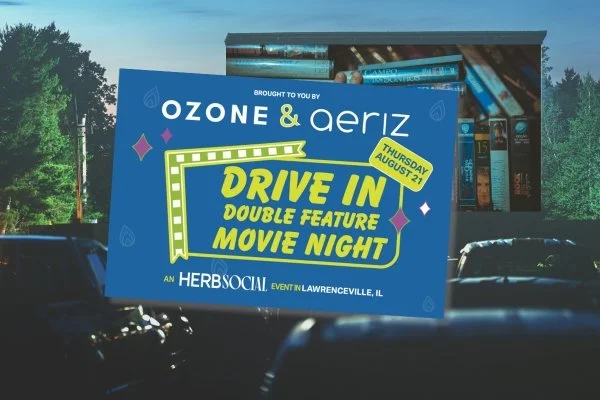 A digital billboard advertising a drive-in double feature movie night event sponsored by Ozone & Aeriz, scheduled for Thursday, August 21, in Lawrenceville, Illinois.