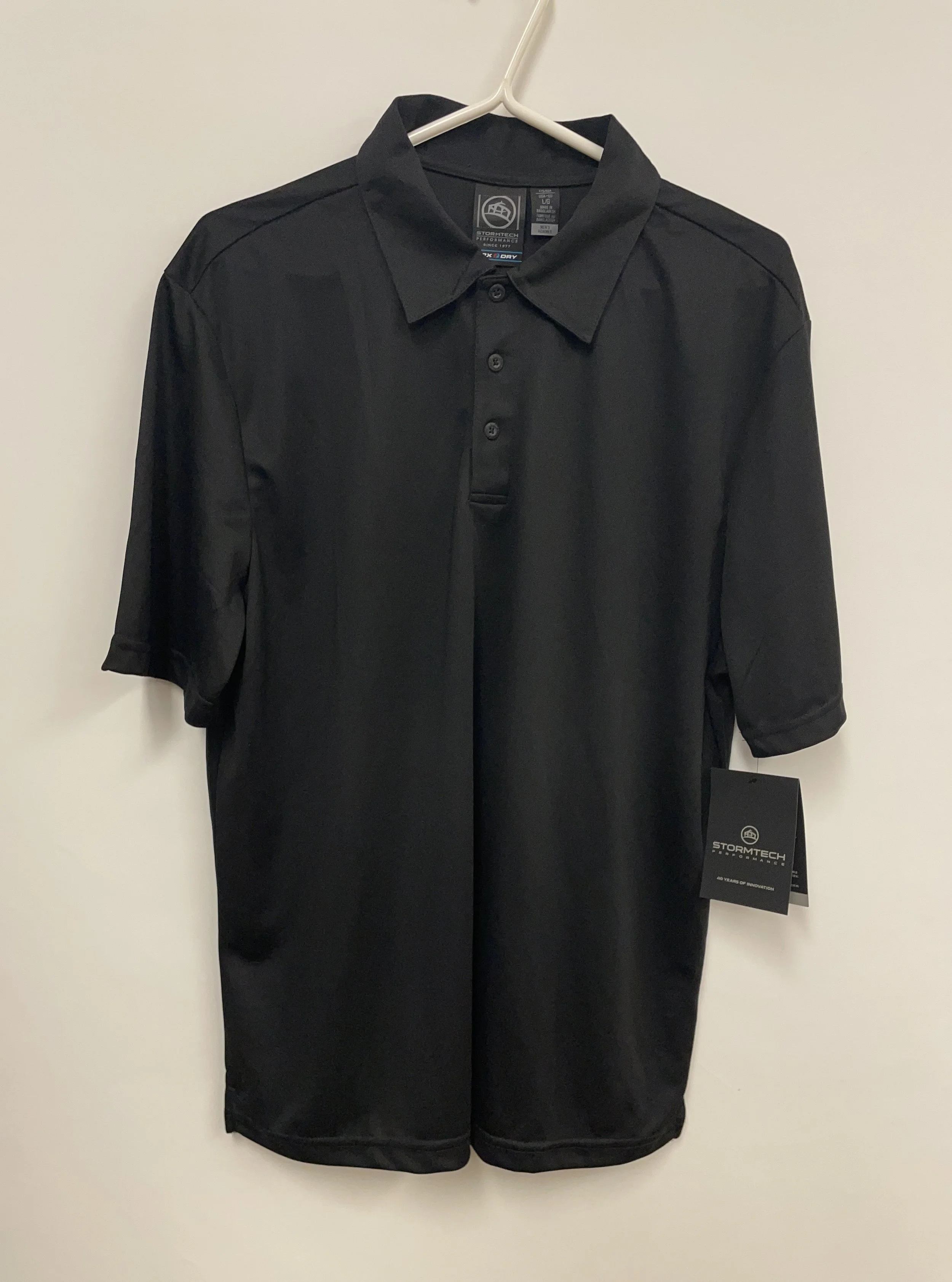 NEUF, polo noir, STORMTECH Performance, 100% polyester, taille L.