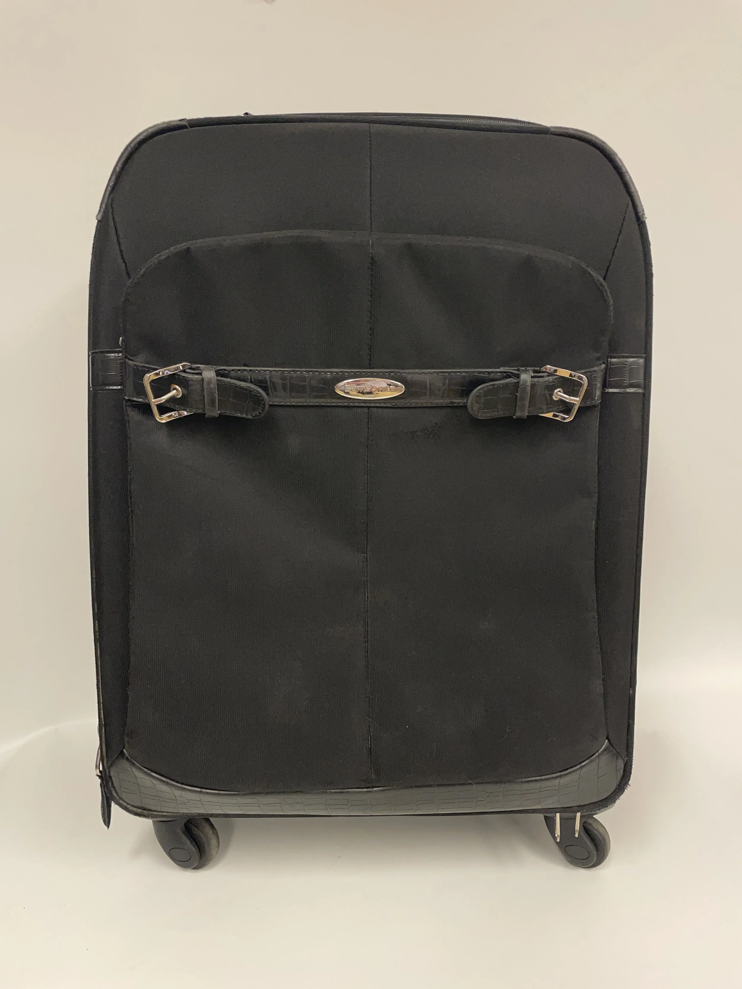 Valise noire 4 roulettes, SAMSONITE, haut. 65 cm, larg. 41 cm, un peu d'usure .