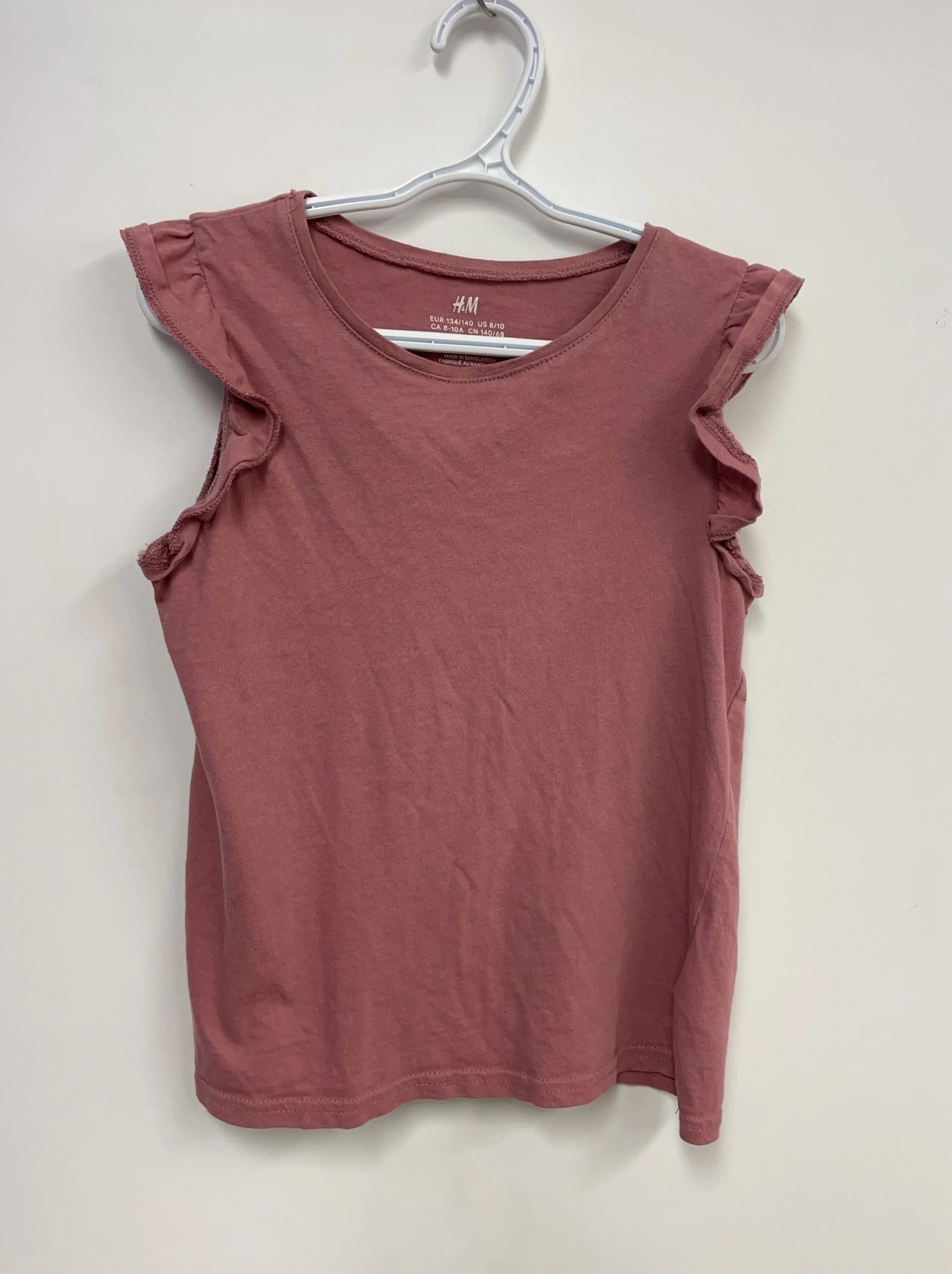 Chandail sans manches rose saumon, H&M, 100% cotton, 8-10 ans.