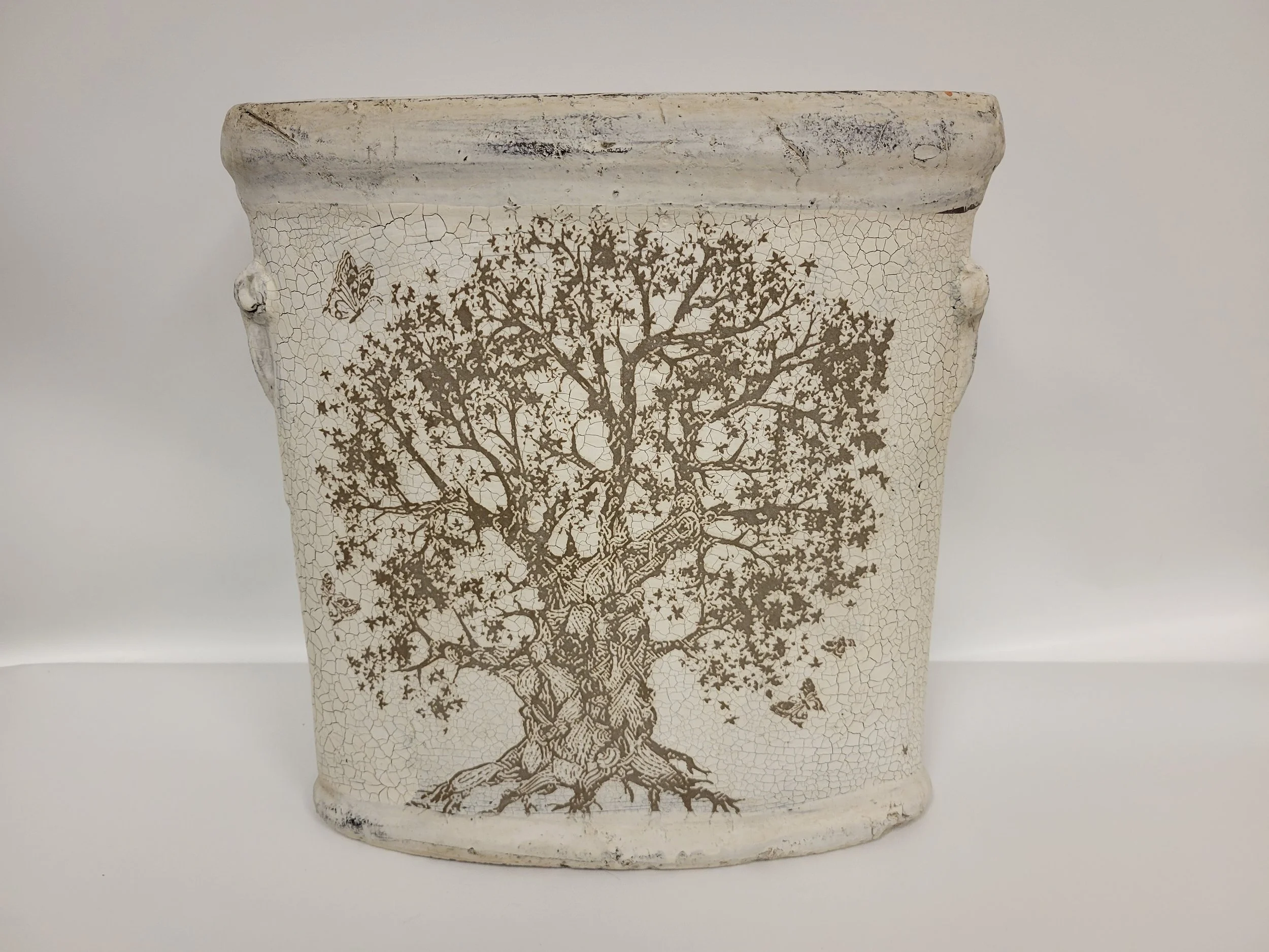 Vase haut et ovale, crème avec un arbre