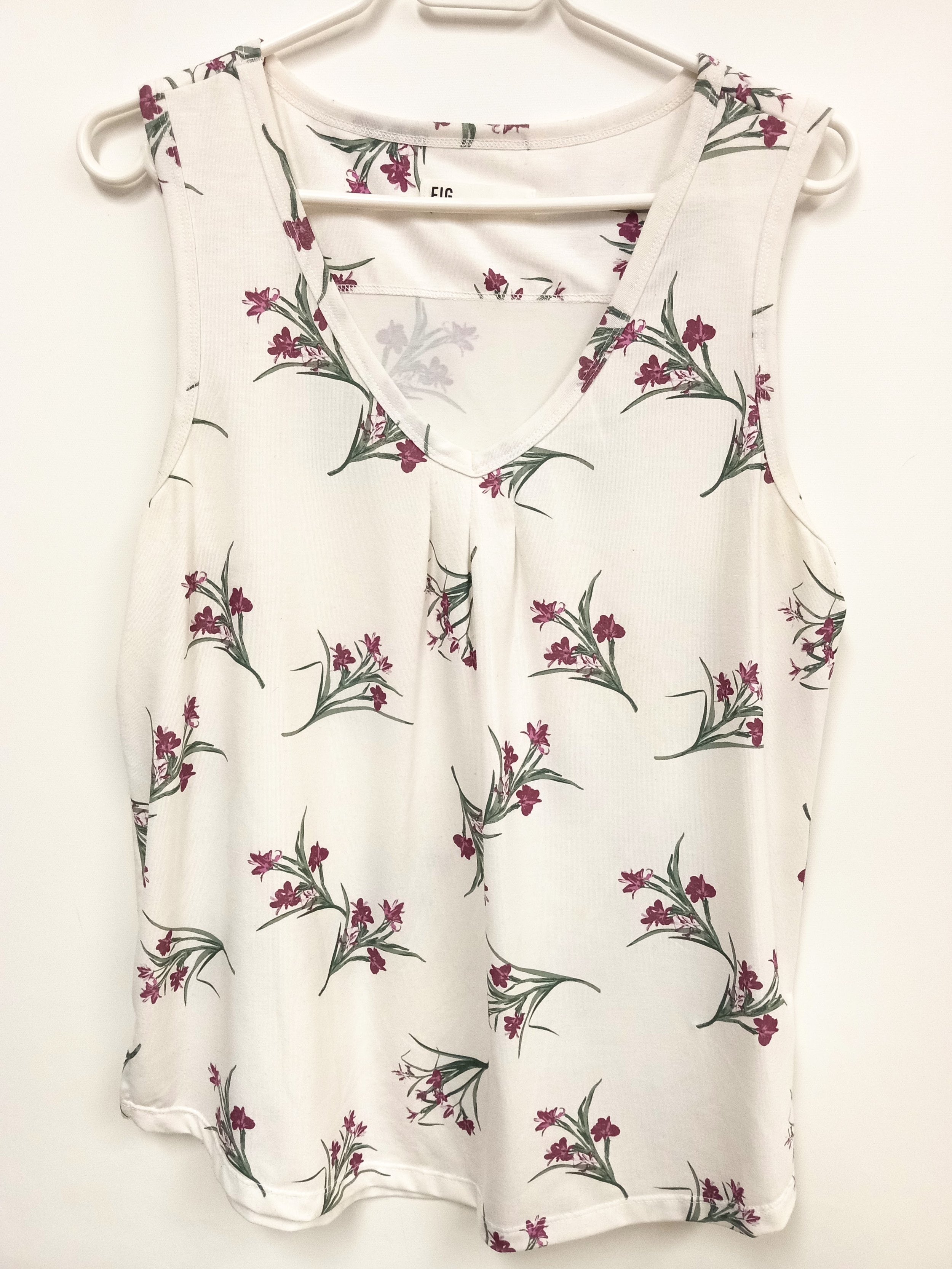Haut blanc avec fleurs magentas, fait au Canada, FIG, L