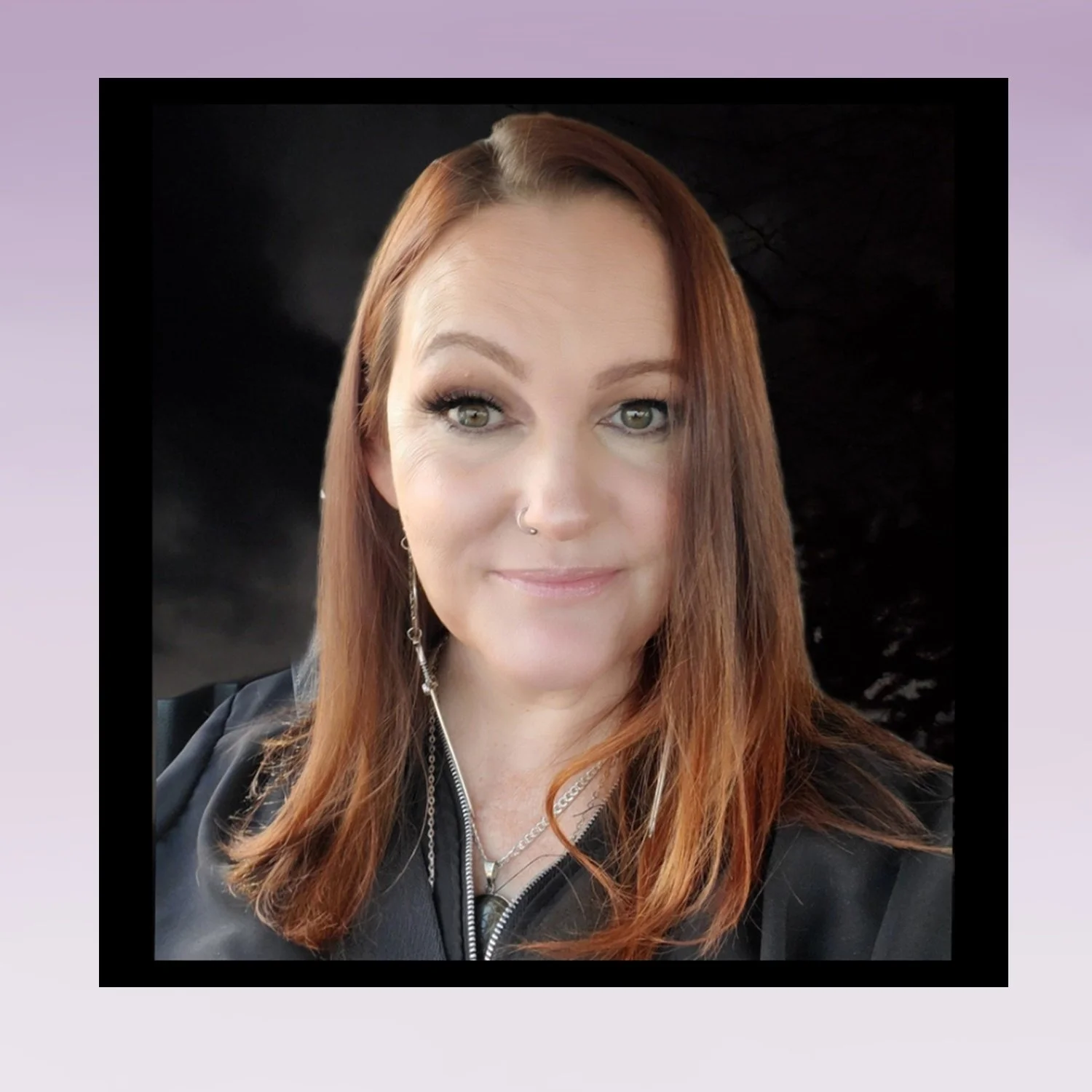 Woman with red hair smiling at camera