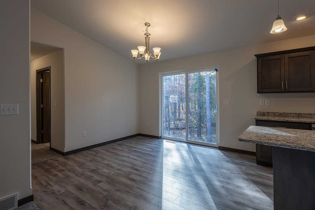 Pecan G1 dining area with patio door
