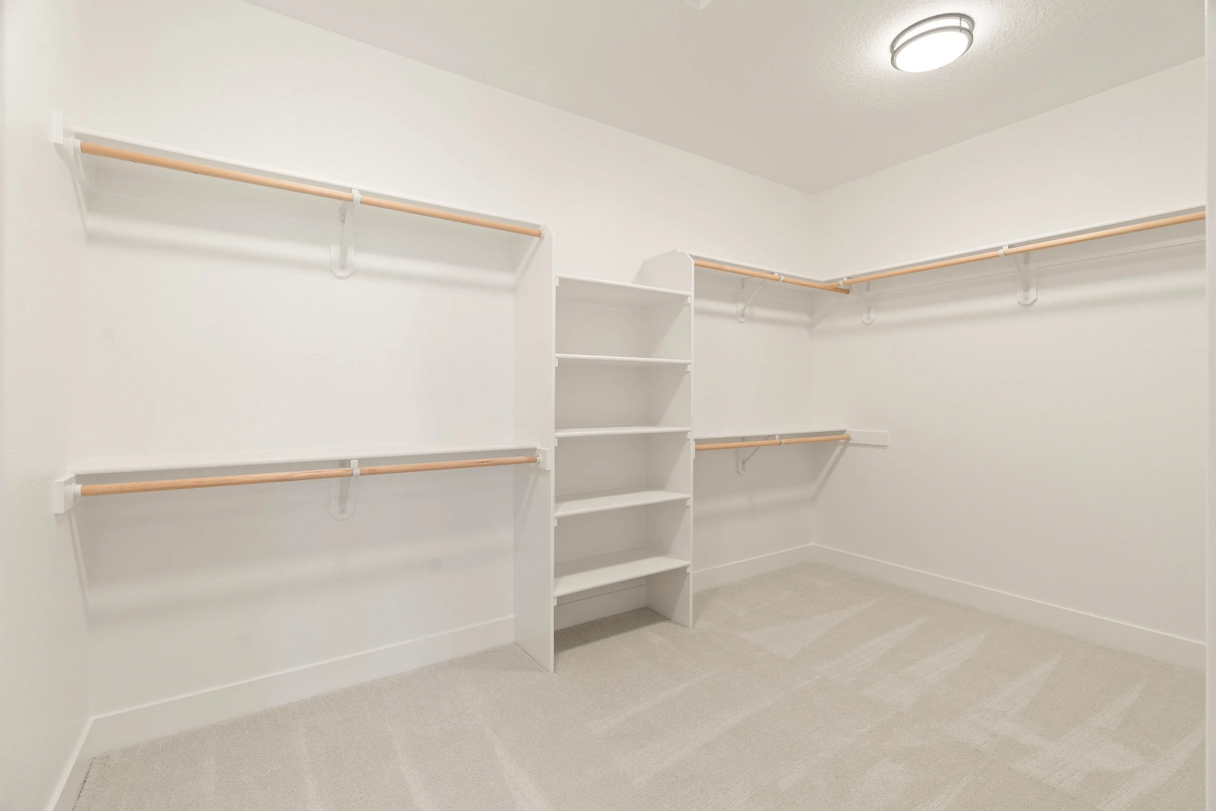 New construction luxury home primary ensuite closet in West Linn, Oregon by The Portlock Company
