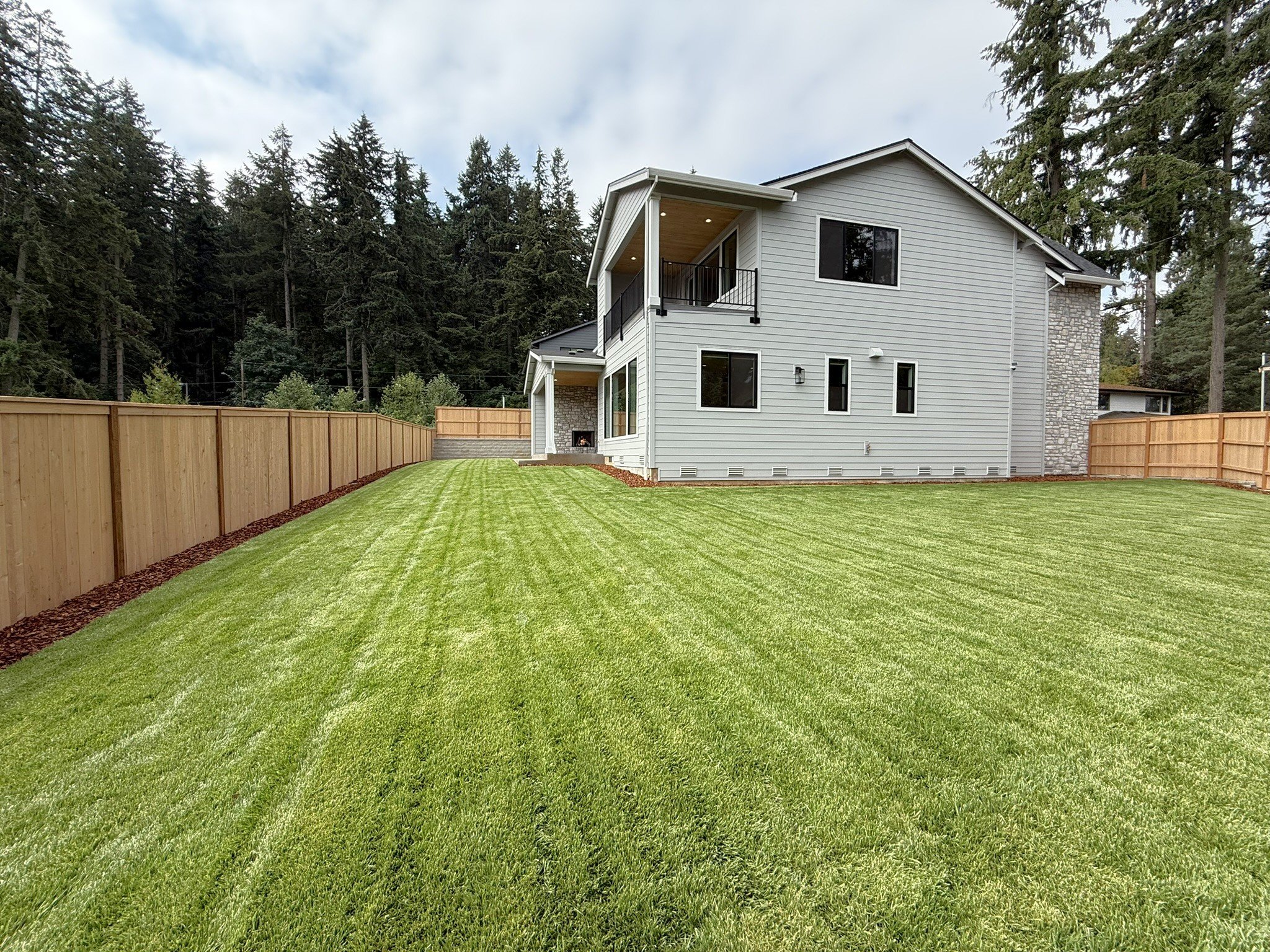 New construction luxury home in West Linn, Oregon, crafted by The Portlock Company — the Portland area’s trusted local home builder. 