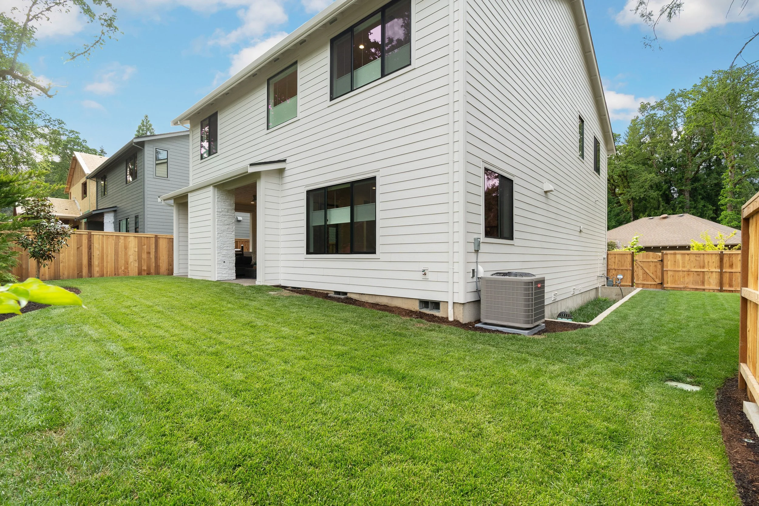 New construction luxury home in West Linn, Oregon, crafted by The Portlock Company — the Portland area’s trusted local home builder. 