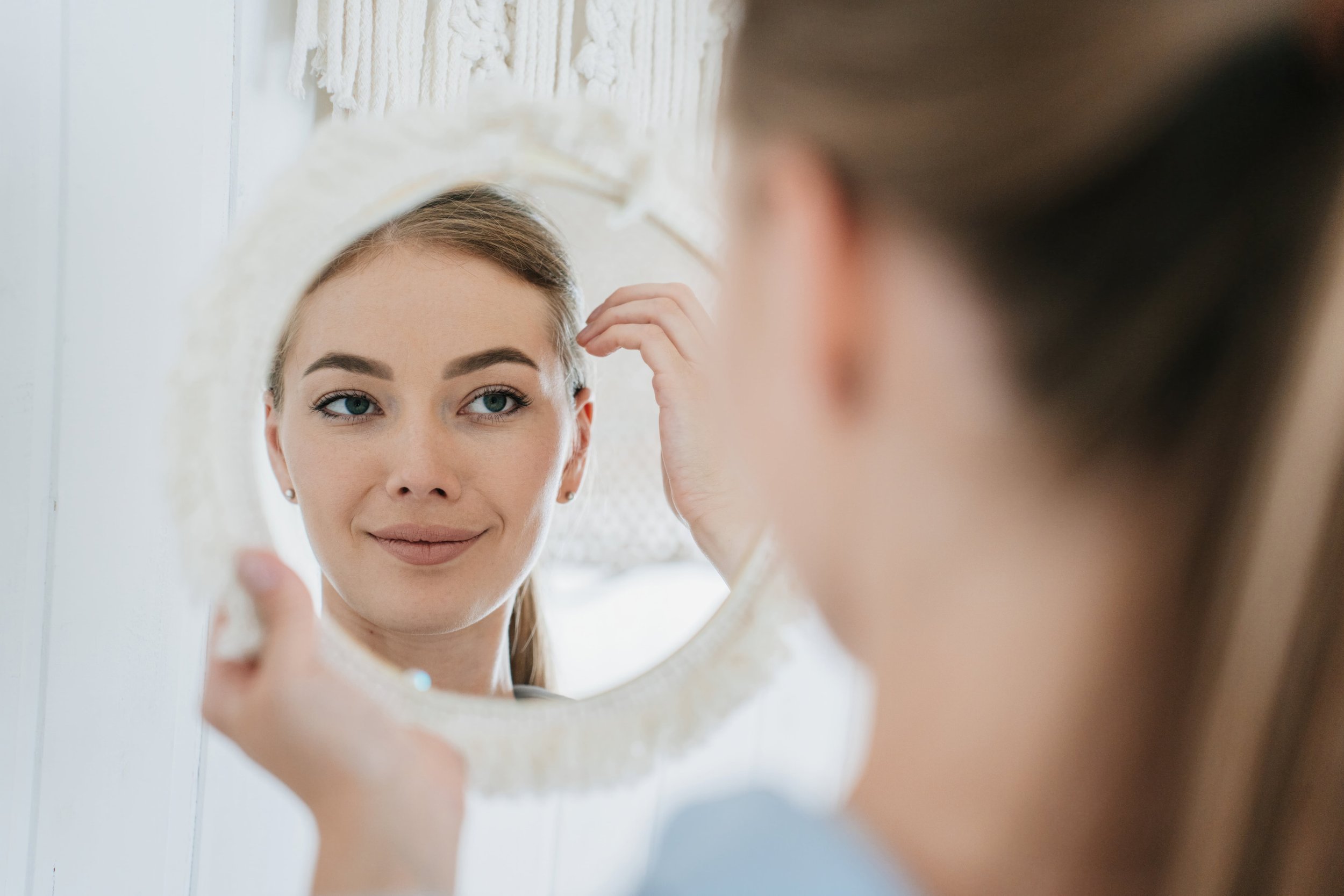woman using a mirror