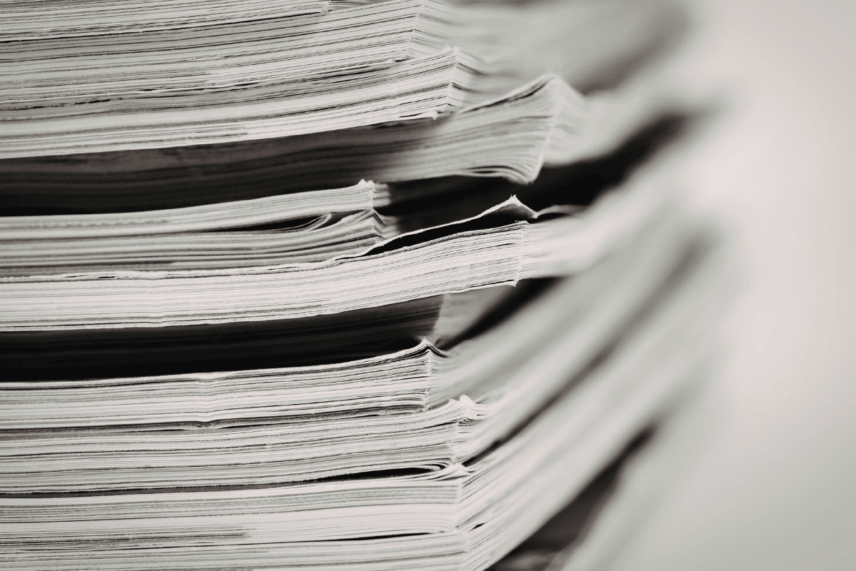 A stack of papers to represent digital transformation.