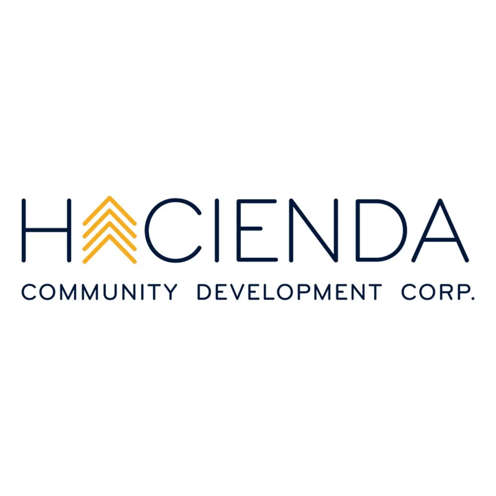 Logo of Haciendas Community Development Corp., with stylized yellow arrows pointing upward within the letter H.