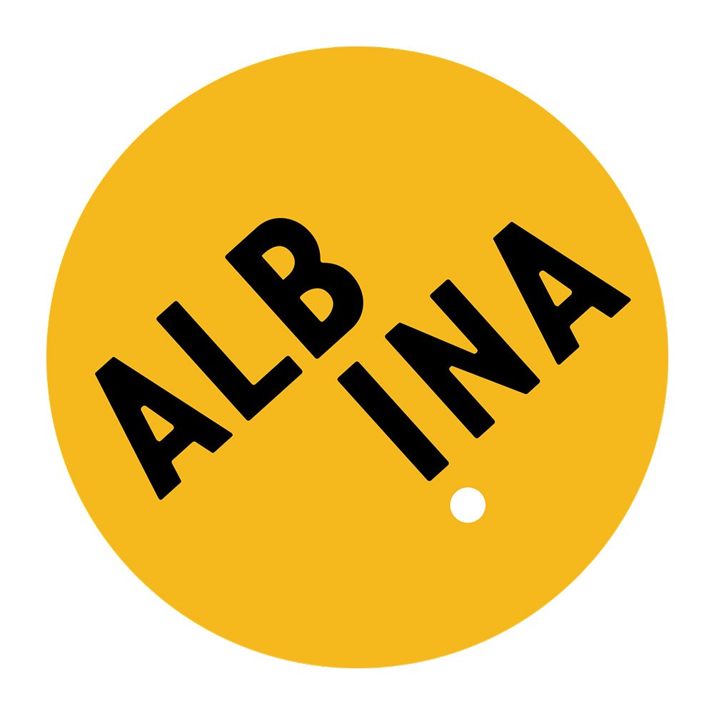 Yellow circular tag with the words 'ALBA INA' in black, arranged diagonally.