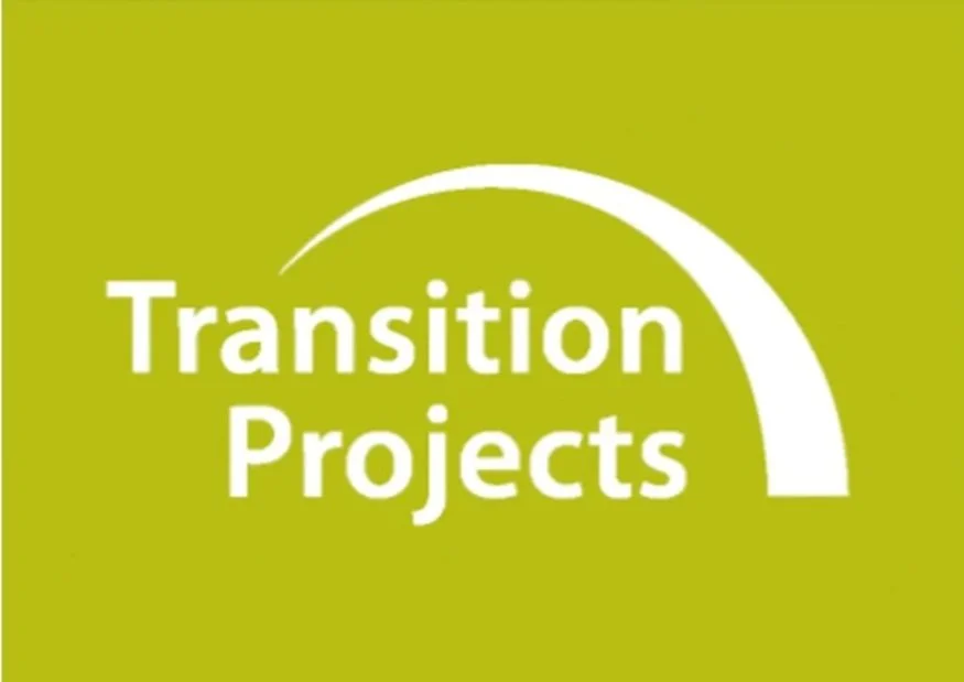 Green background with white text reading "Transition Projects" and a curved white arrow above the text.