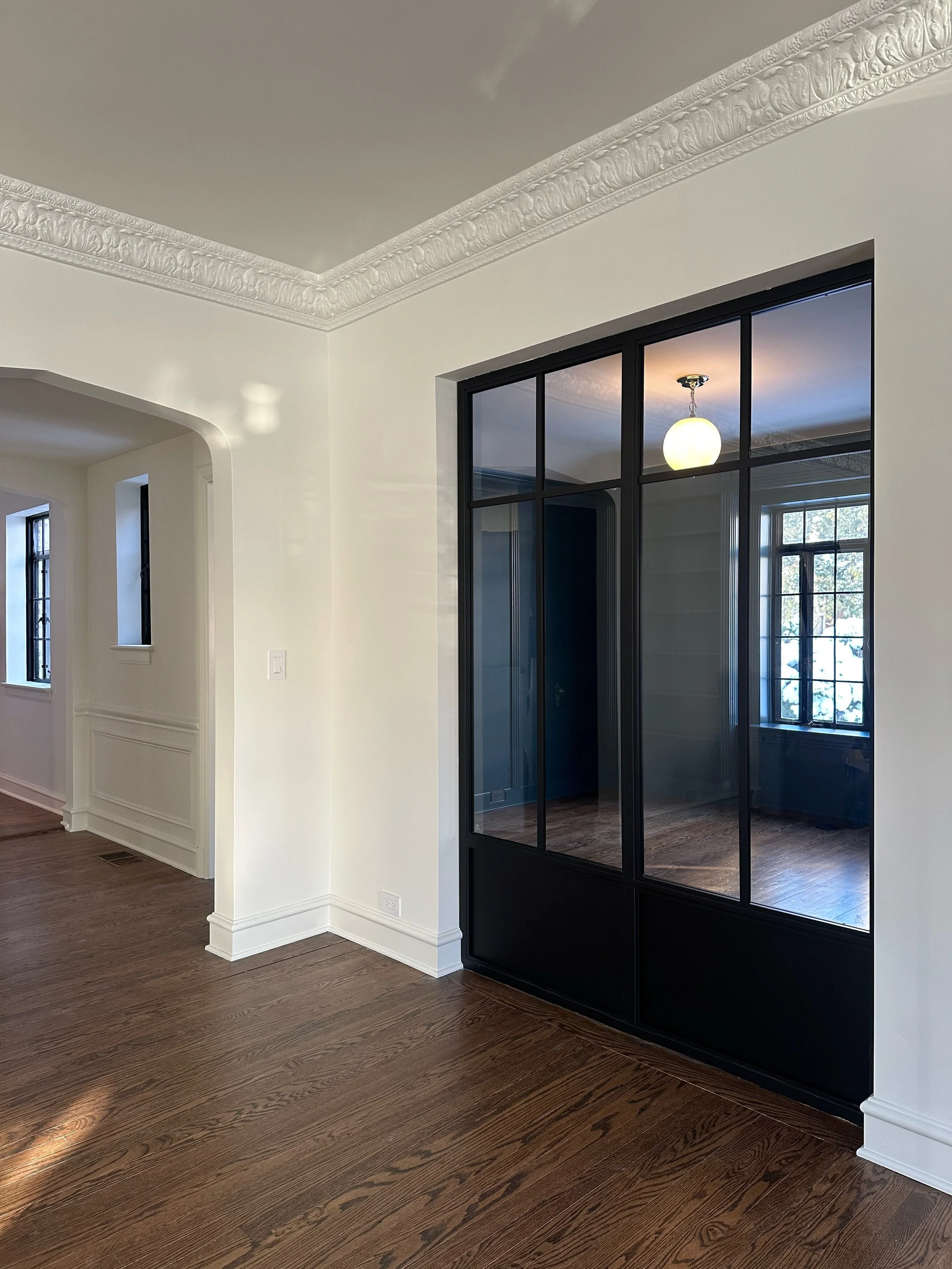 When architects &amp; designers come to us with bright visions (especially ones that pertain moving windows and doors) we get excited.

This living room shared a wall with the office, but the natural light from the back of the house stopped there. To
