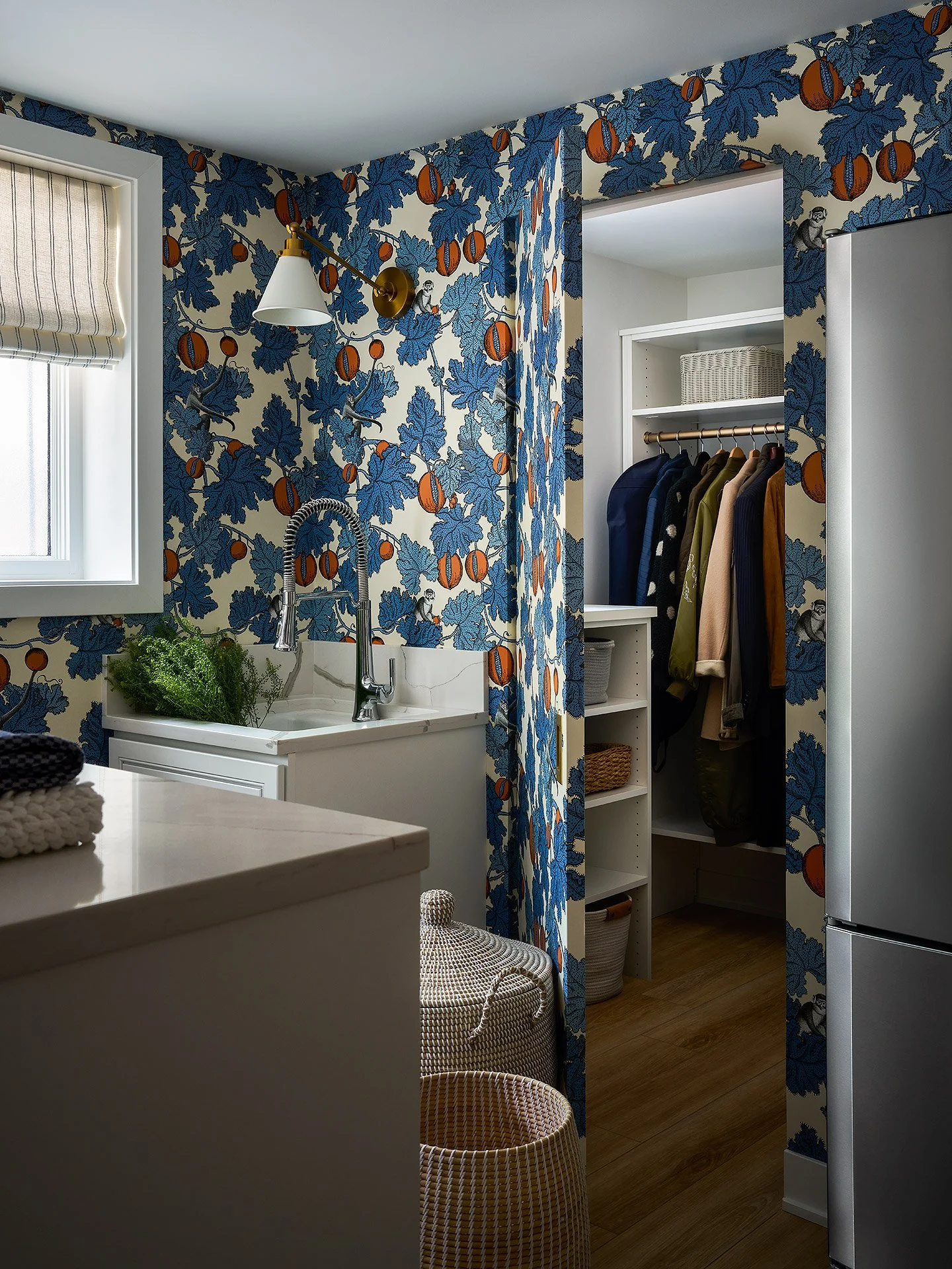 A closet door wrapped in wallpaper