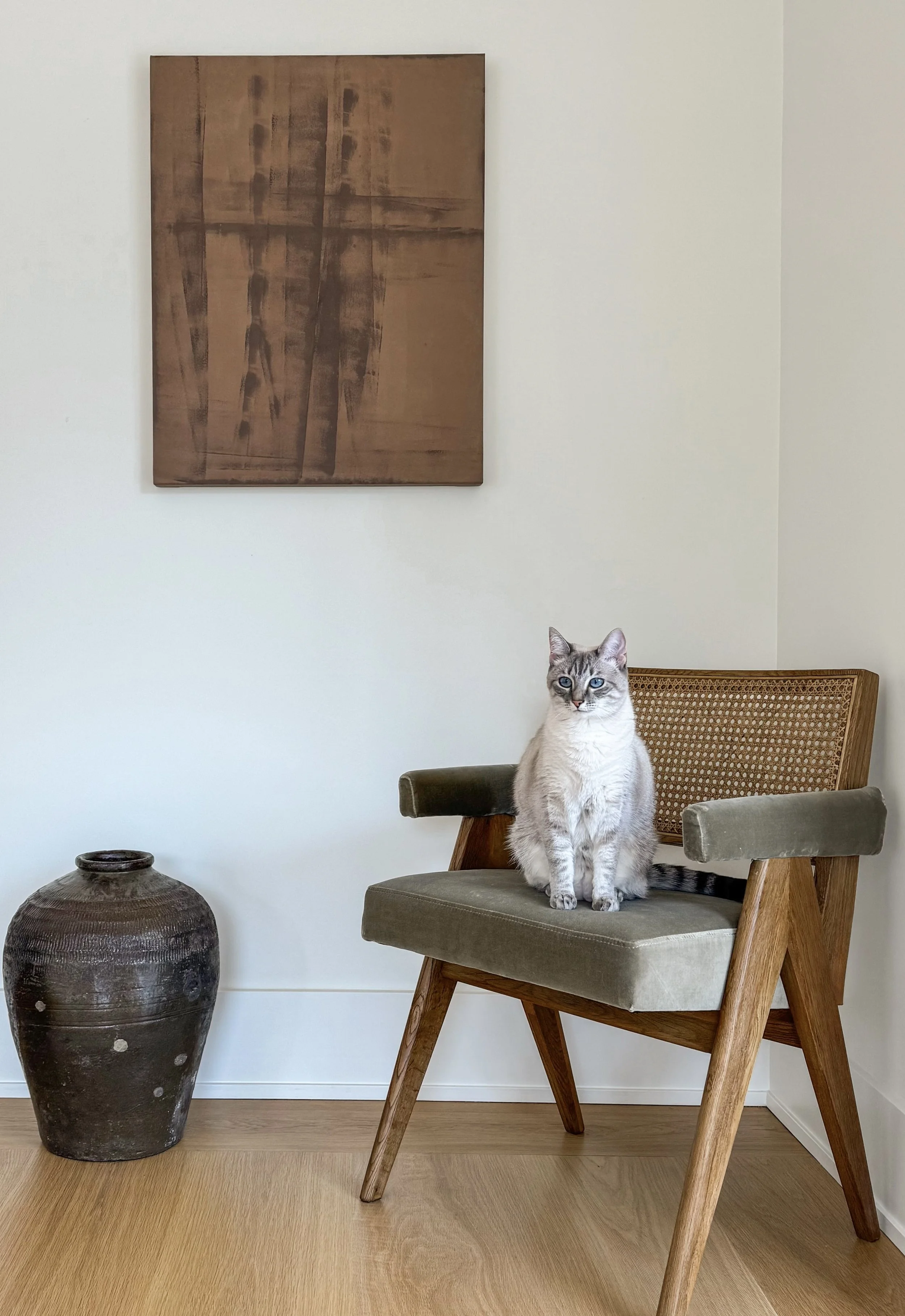 Frequency 01, an abstract painting at the home of artist Christie Raju with white cat. 
