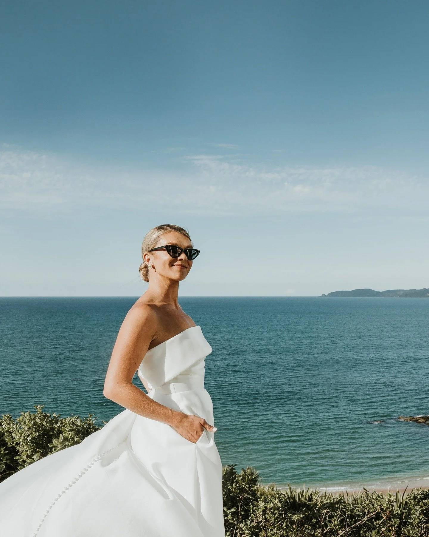 Spotlight on Charlie...

When it looks like a magazine shoot...but actually it's pure Charlie rocking her dress on wedding day!

Oceanside, her hair sleeked back perfectly for their coastal wedding, and her dress blowing magnificent shape in the wind