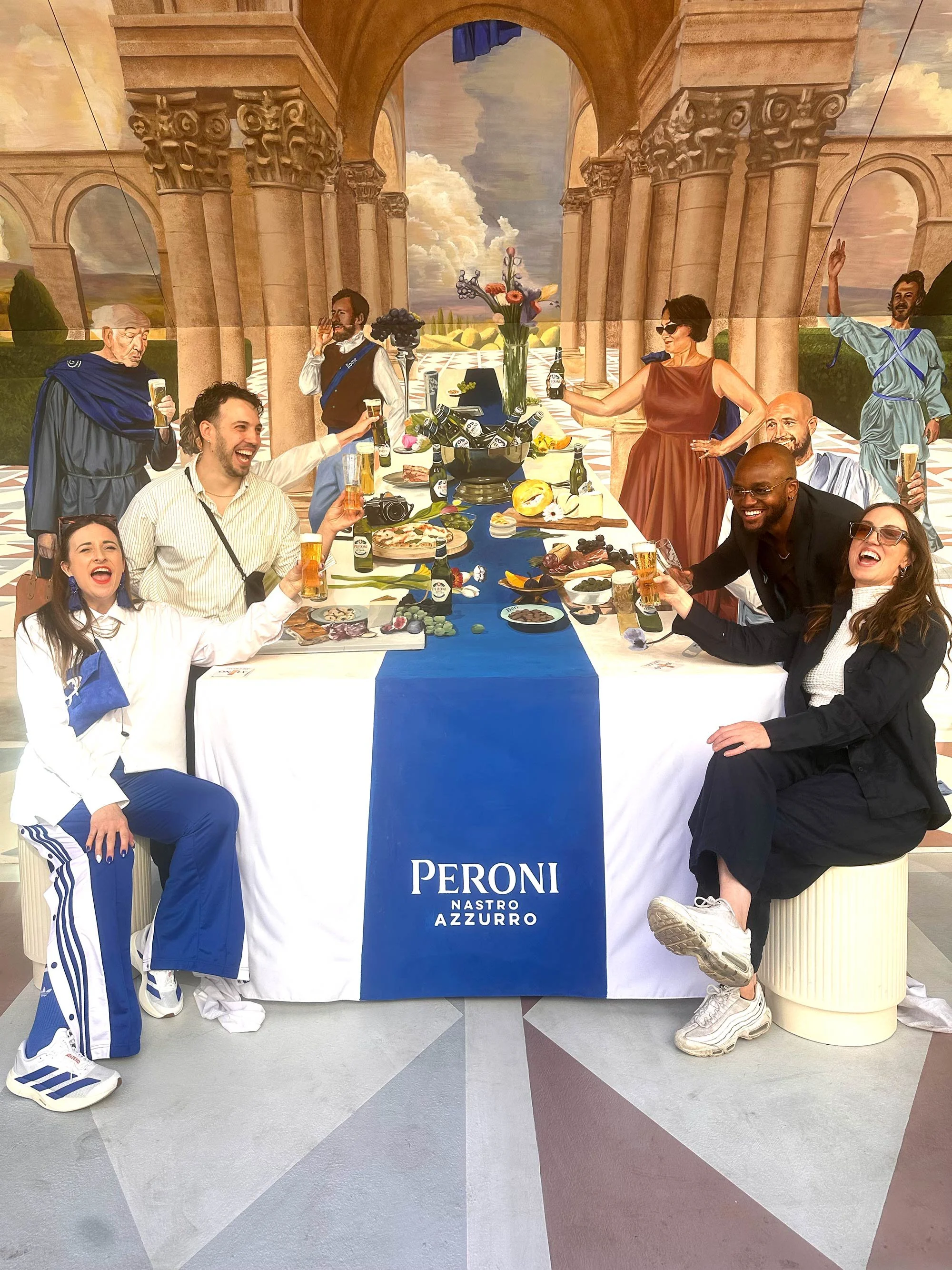 Hand-painted Renaissance-inspired mural created by JOY! Collective for Peroni Nastro Azzurro in Covent Garden, London.