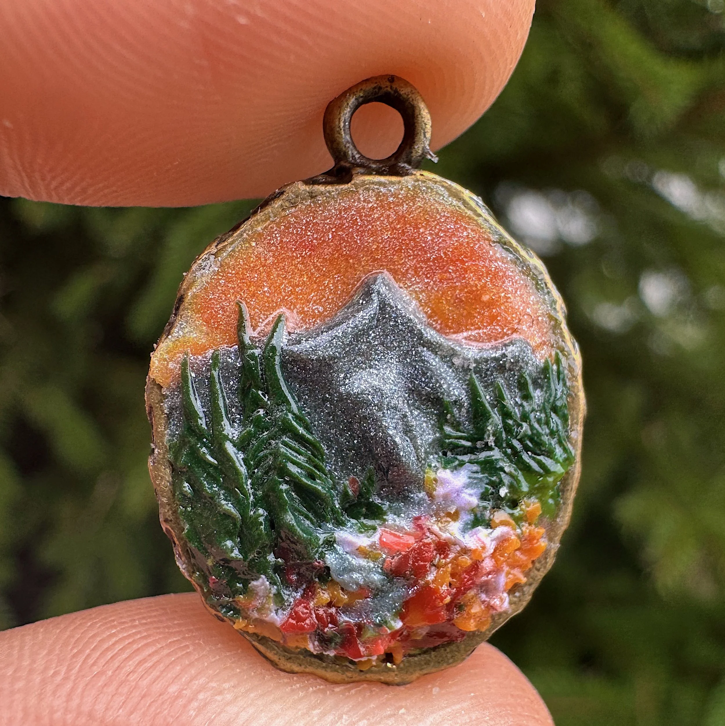 hand-sculpted mountain pendant with sunset skies, brass setting
