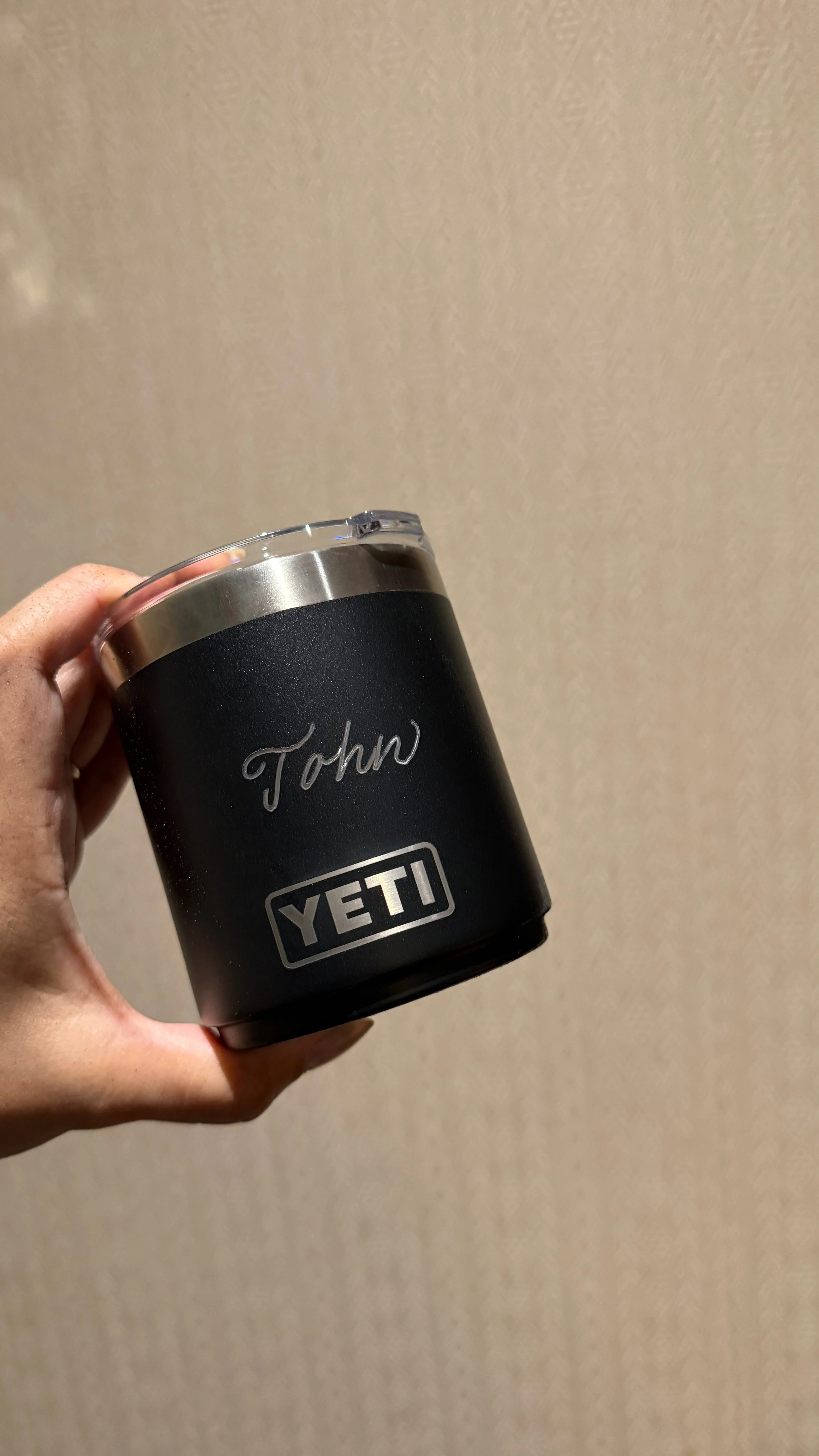 Toronto live engraving artist personalizing YETI mugs for corporate employees