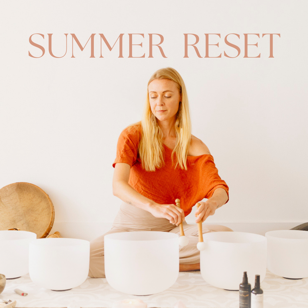 A woman with long blonde hair is sitting on the floor and playing crystal singing bowls, with the text 'Summer Reset' above her.