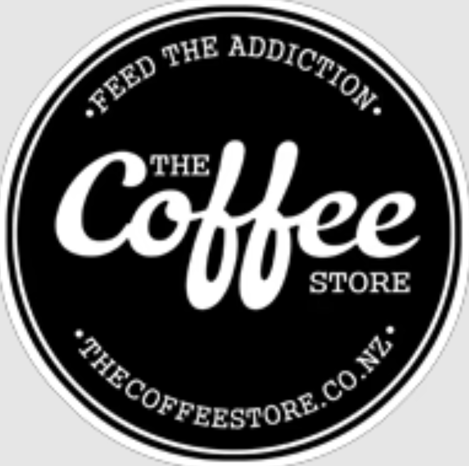 Black circular logo for The Coffee Store with white text reading 'Feed the Addiction' around the top, 'The Coffee Store' in the center, and the website 'thecoffeestore.co.nz' around the bottom.