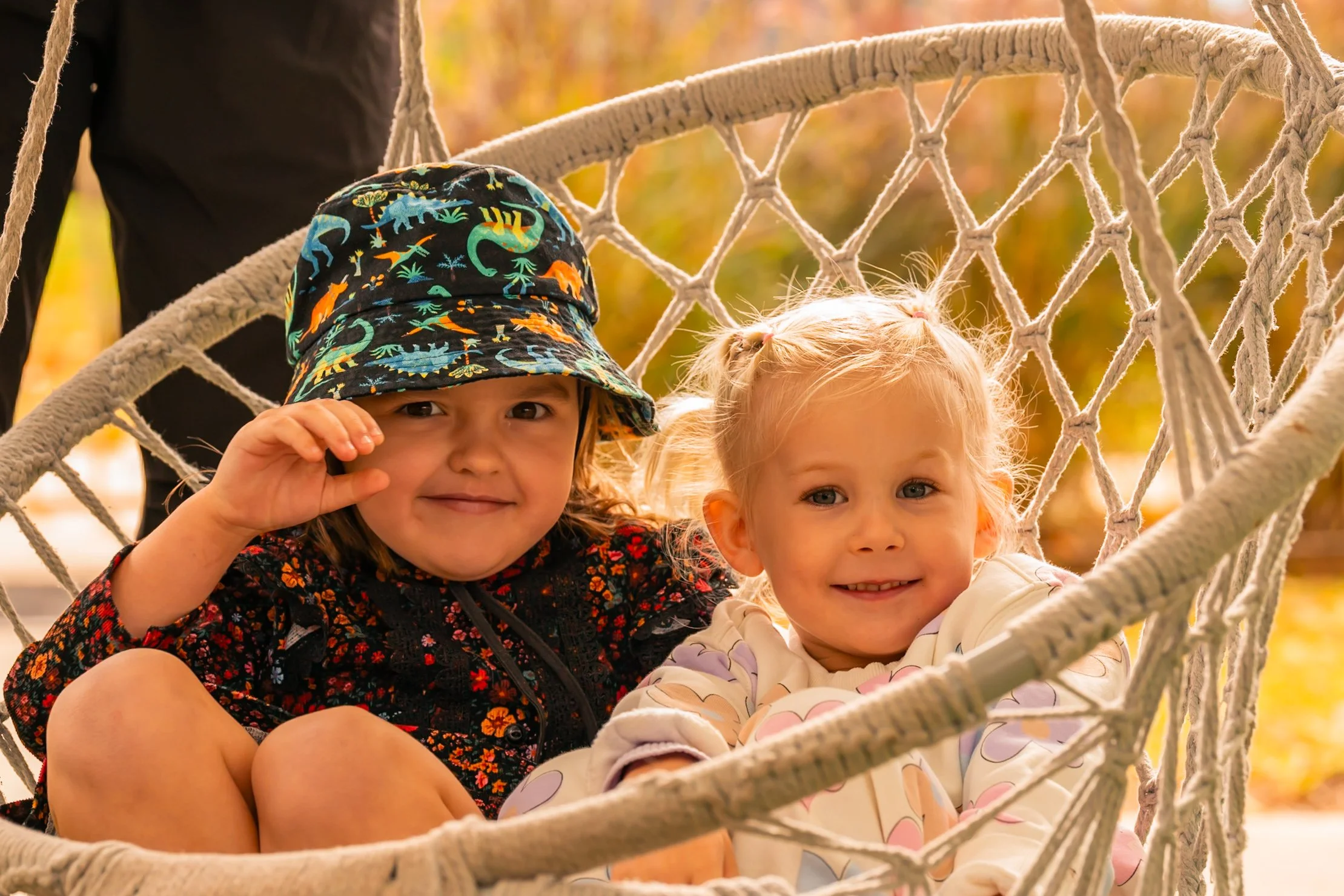 Gumnuts students in a swing outdoors at Lilly Pilly Preps 3 Year Old Program in the outdoor play area at Carinya Christian School, Tamworth