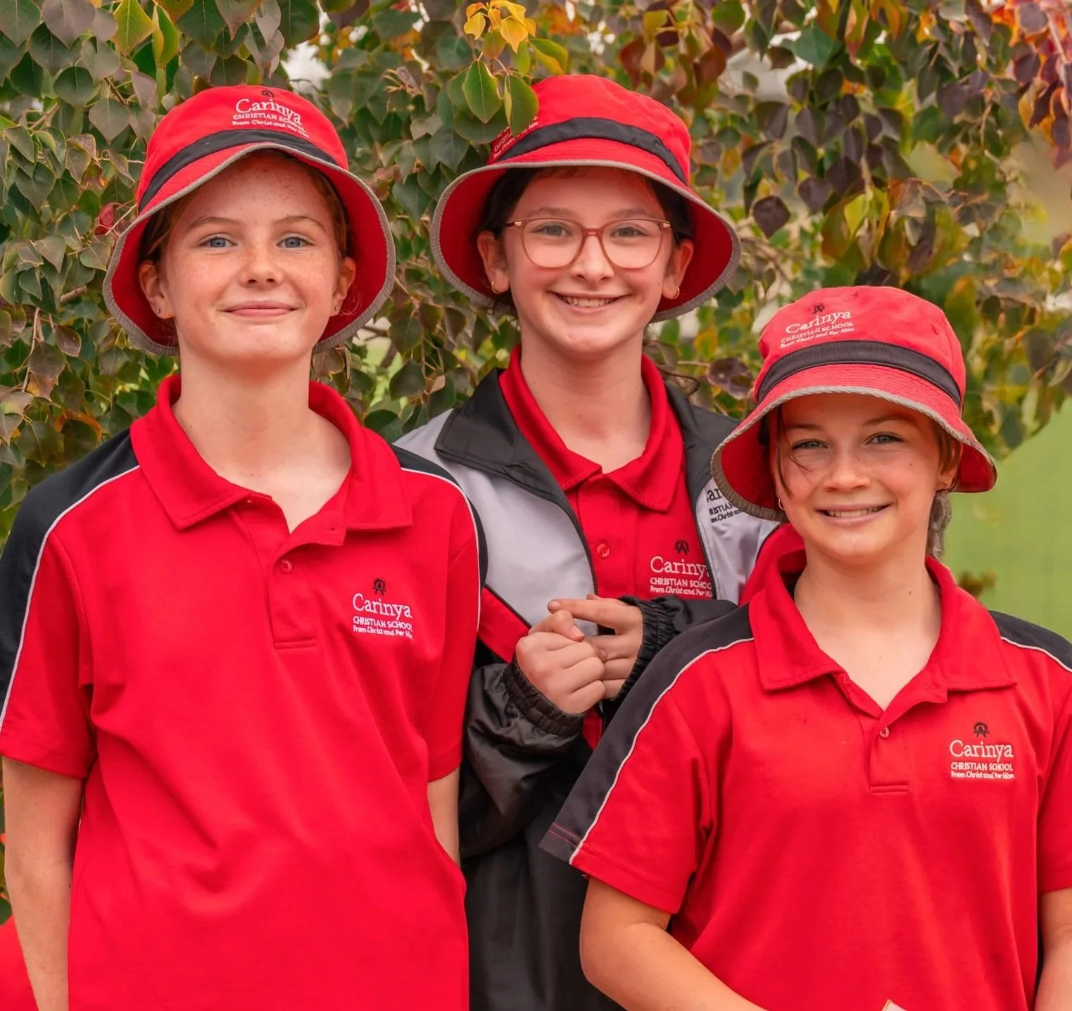 Three female Middle School Students at Carinya Christian School, Tamworth, in the Middle School playground.