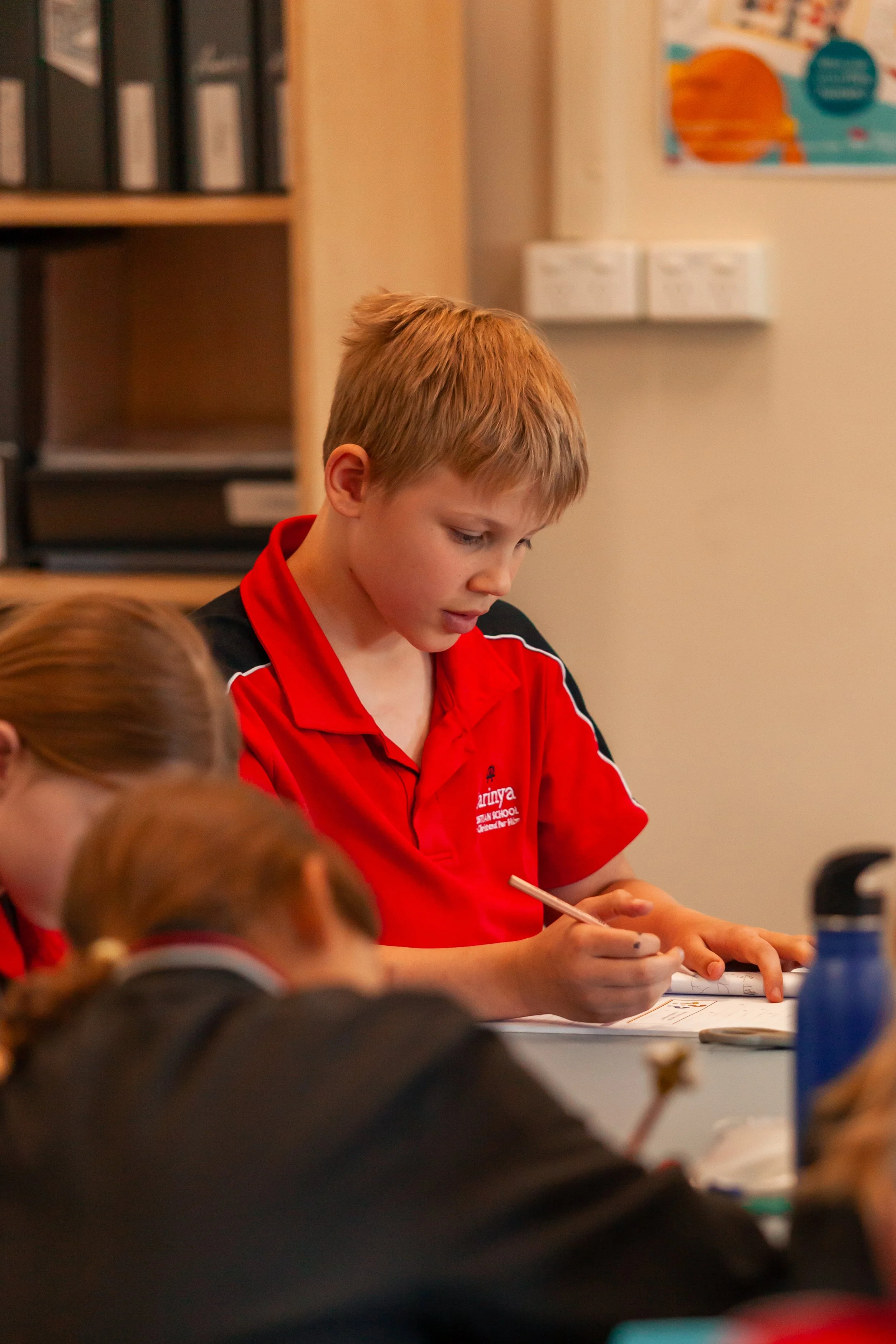A Carinya student inside A Junior School classroom at Carinya Christian School, Gunnedah.