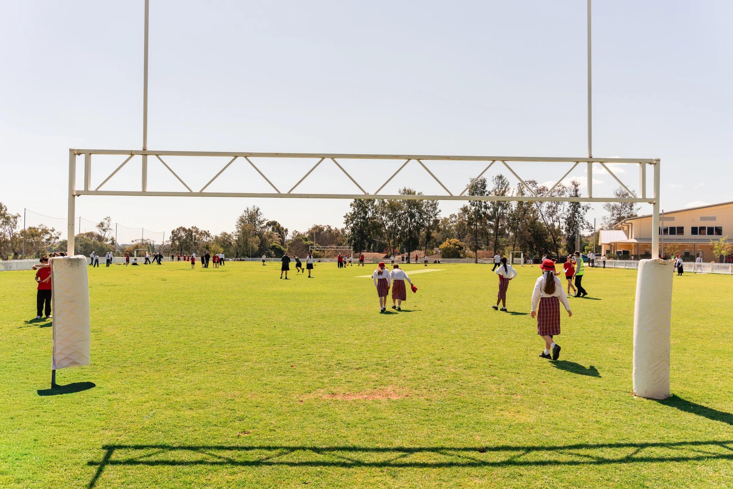 Carinya Students playing rugby on the Large sports oval at Carinya Christian School, Tamworth.