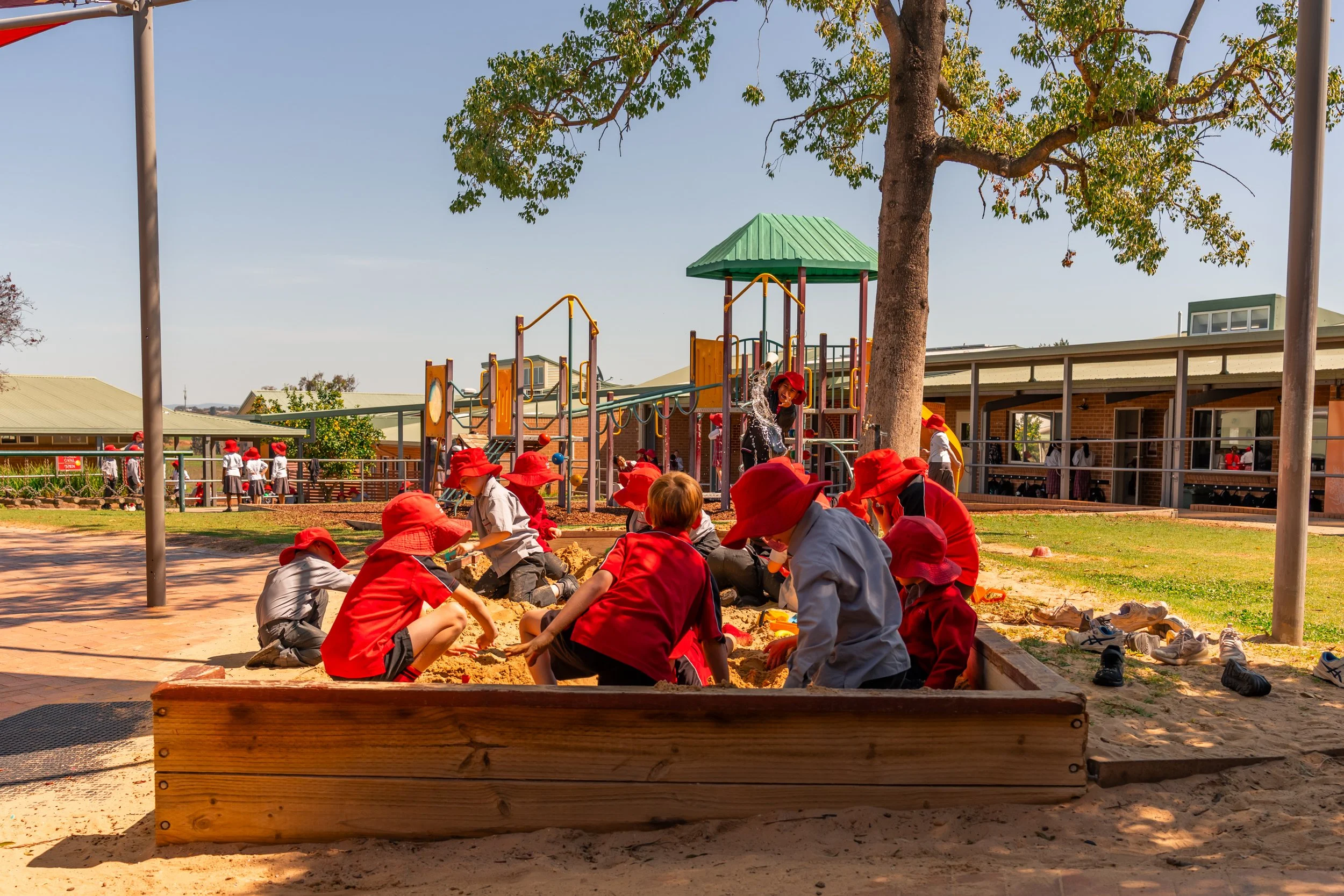Junior School students playing in a sandpit in the Junior School play area at Carinya Christian School, Tamworth.