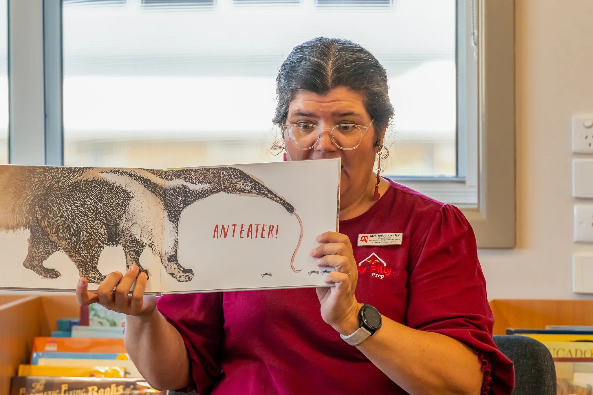 Mrs Rebecca Dye, reading a children's book during Carinya Christian Schools' Under 5s Storytime in the School Library at Carinya Tamworth.
