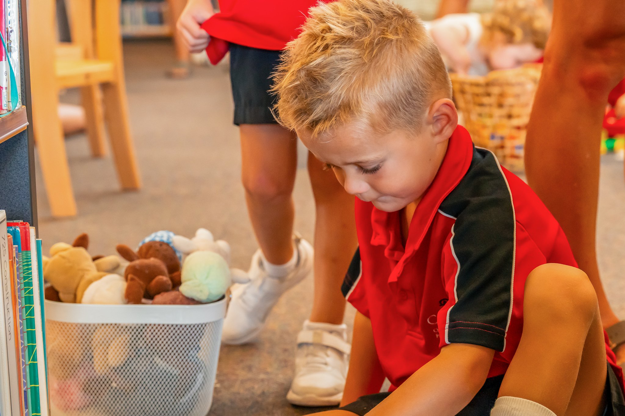 A Prep Student playing with a parent during Carinya Christian Schools' Under 5s Storytime in the School Library at Carinya Tamworth.