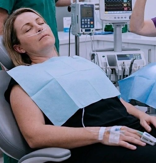 IV twilight sedation female patient in dental chair image