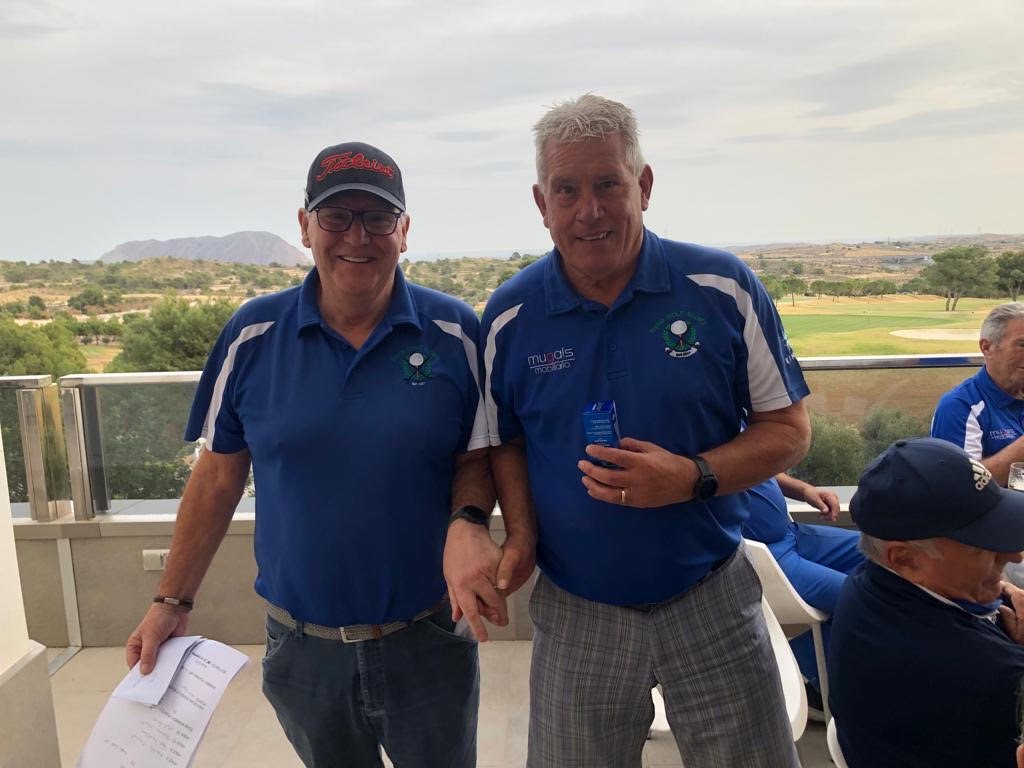 Captain Harry Rice presenting Keith Osgood with his prize of 3 Sucina GS golf balls for nearest the pin.