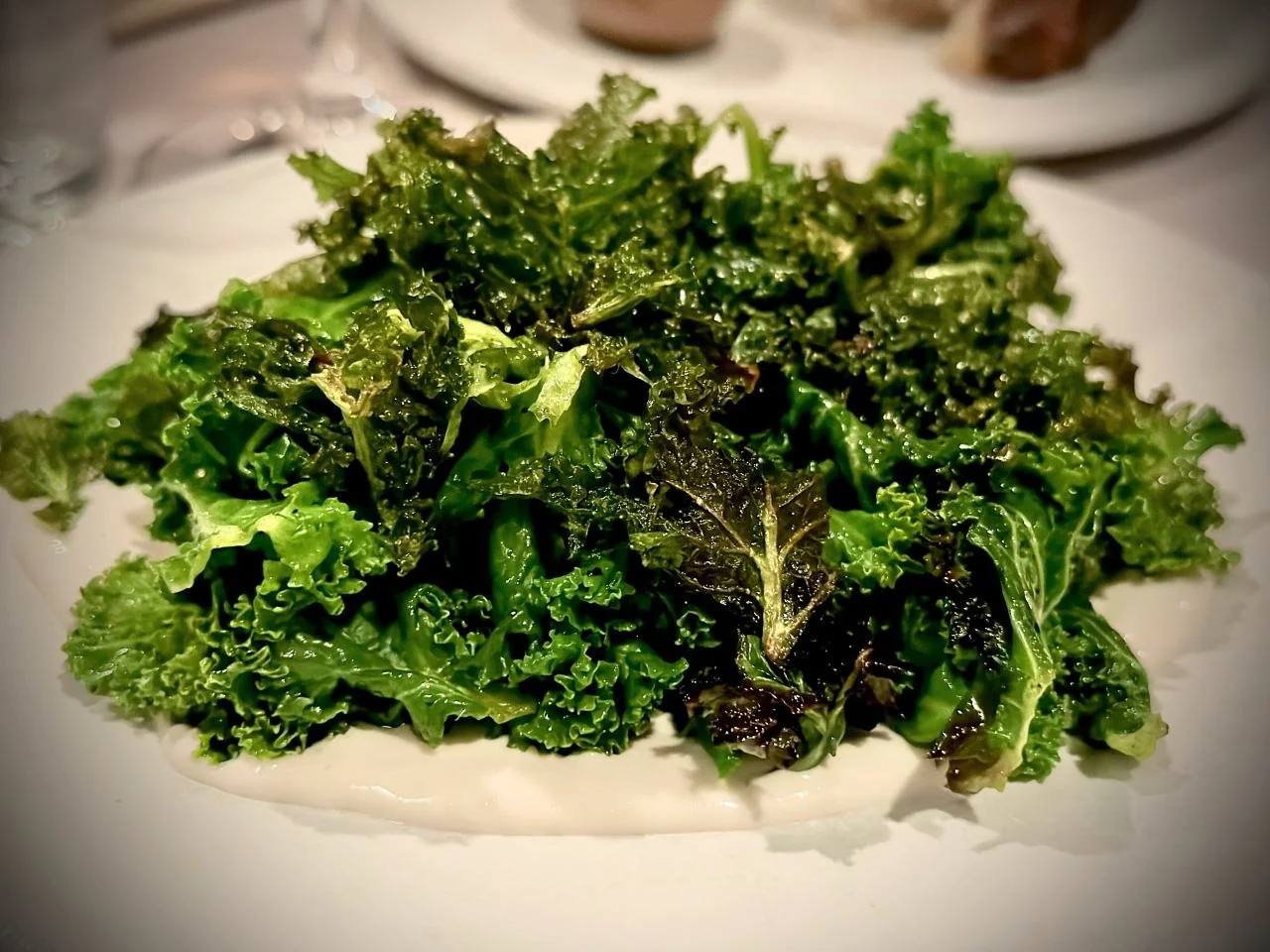 Kale on a light cream base at Restaurant Otto in Berlin. Vadim uses vegetables from his own garden or local producers for this dish.