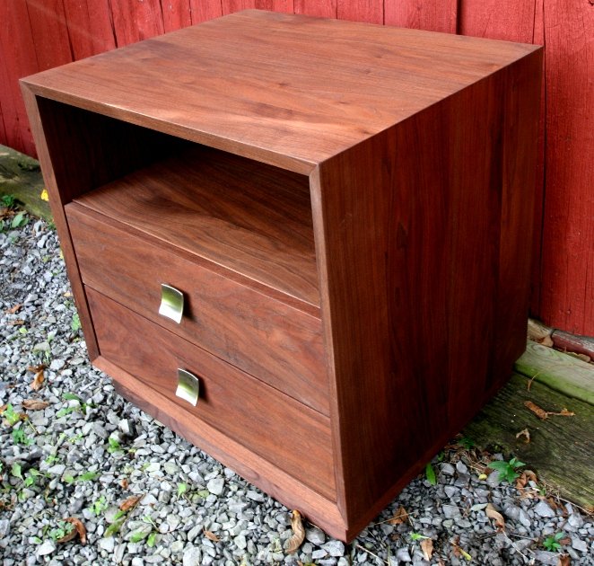 This custom end table/night stand uses a more contemporary design accented with contemporary drawer pulls.
