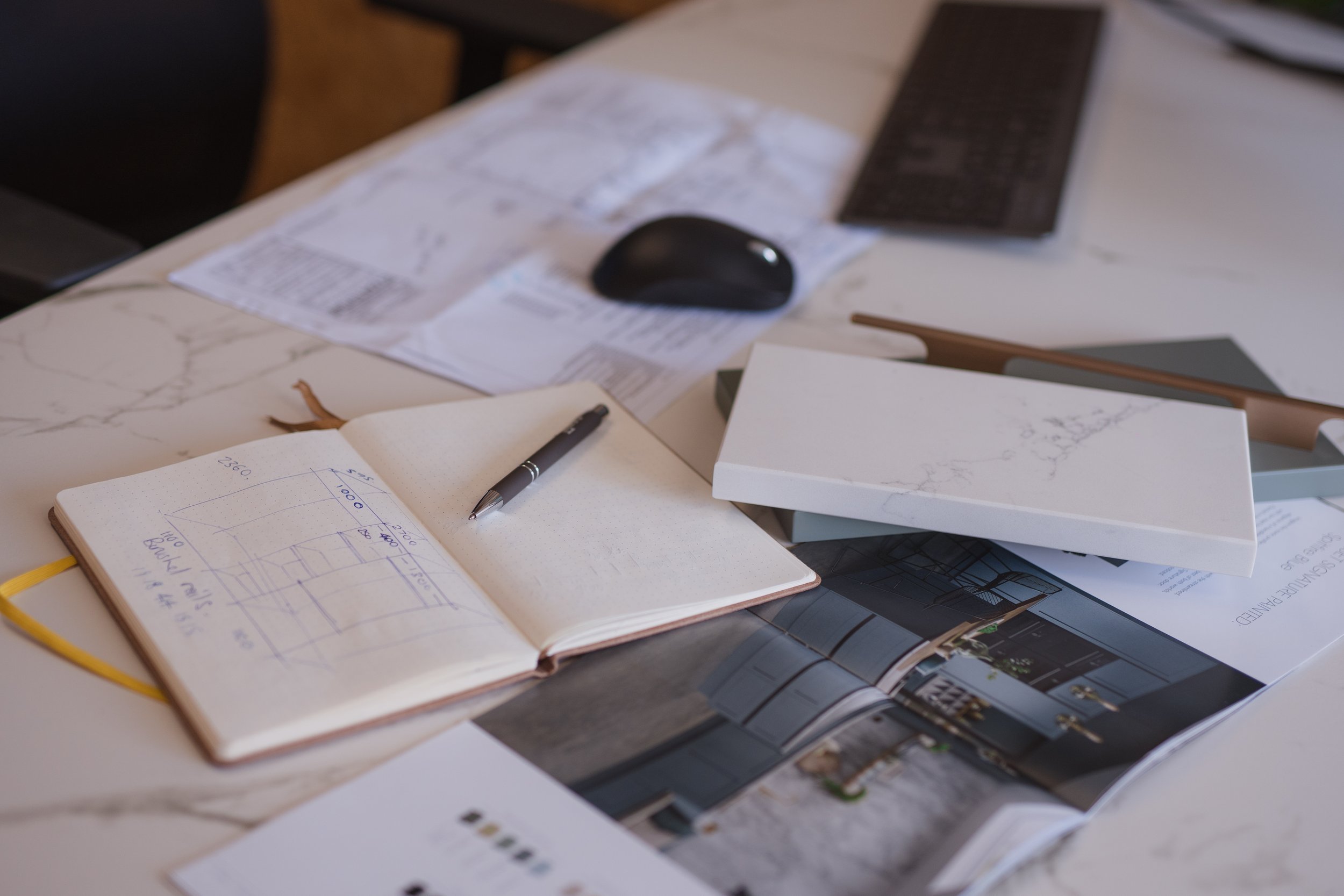 3D kitchen design visuals and material samples laid out for client presentation – The Kitchen Den Bradley Stoke.